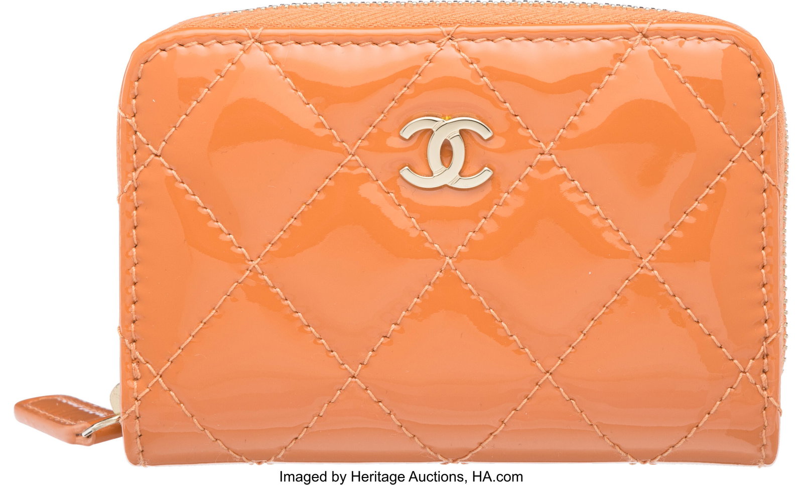 Chanel Orange Quilted Patent Leather Zip Around: Chanel Orange Quilted Patent Leather Zip Around Card Case with Gold Hardware Condition: 1 4.25" Width x 3" Height x 1" Depth This wallet is done in Orange Patent Leather with Gold Hardwar