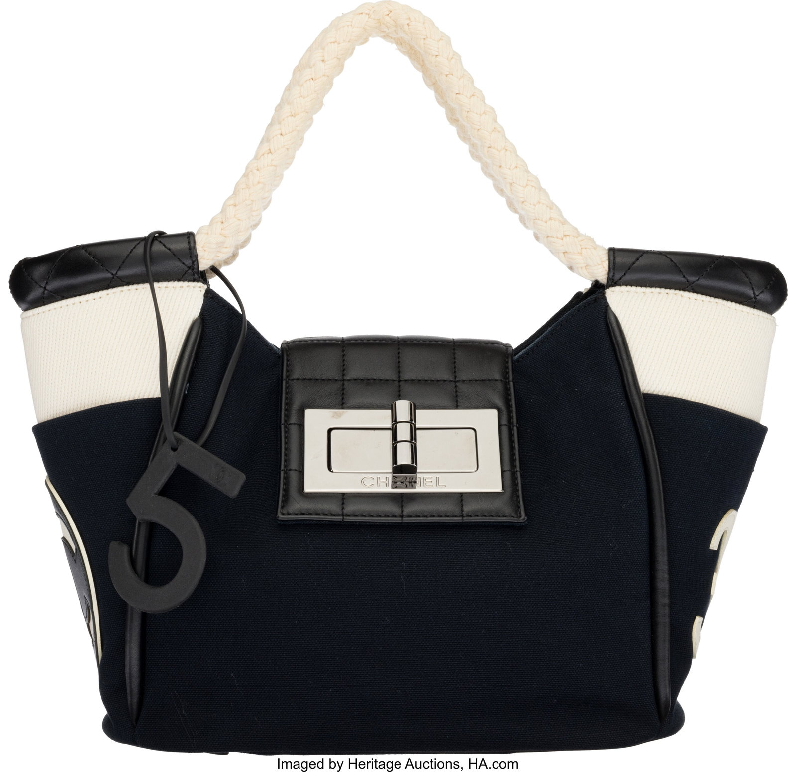 Chanel Navy Blue Canvas & Black Leather Rope Cab: Chanel Navy Blue Canvas & Black Leather Rope Cabas Tote with Silver Hardware 2004-2005 Condition: 2 10" Width x 9" Height x 5.25" Depth This bag is done in Navy Canvas with Black Leat