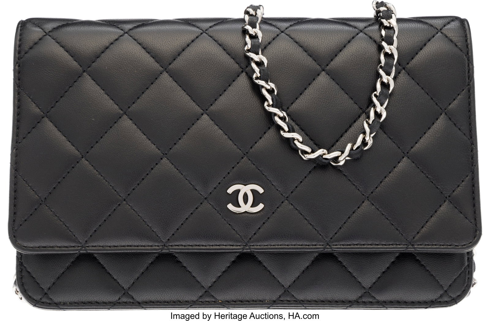 Chanel Black Quilted Lambskin Leather Wallet On: Chanel Black Quilted Lambskin Leather Wallet On Chain with Silver Hardware 2011 Condition: 2 7.5" Width x 5" Height x 1.5" Depth This bag is done in Black Lambskin Leather with Sil