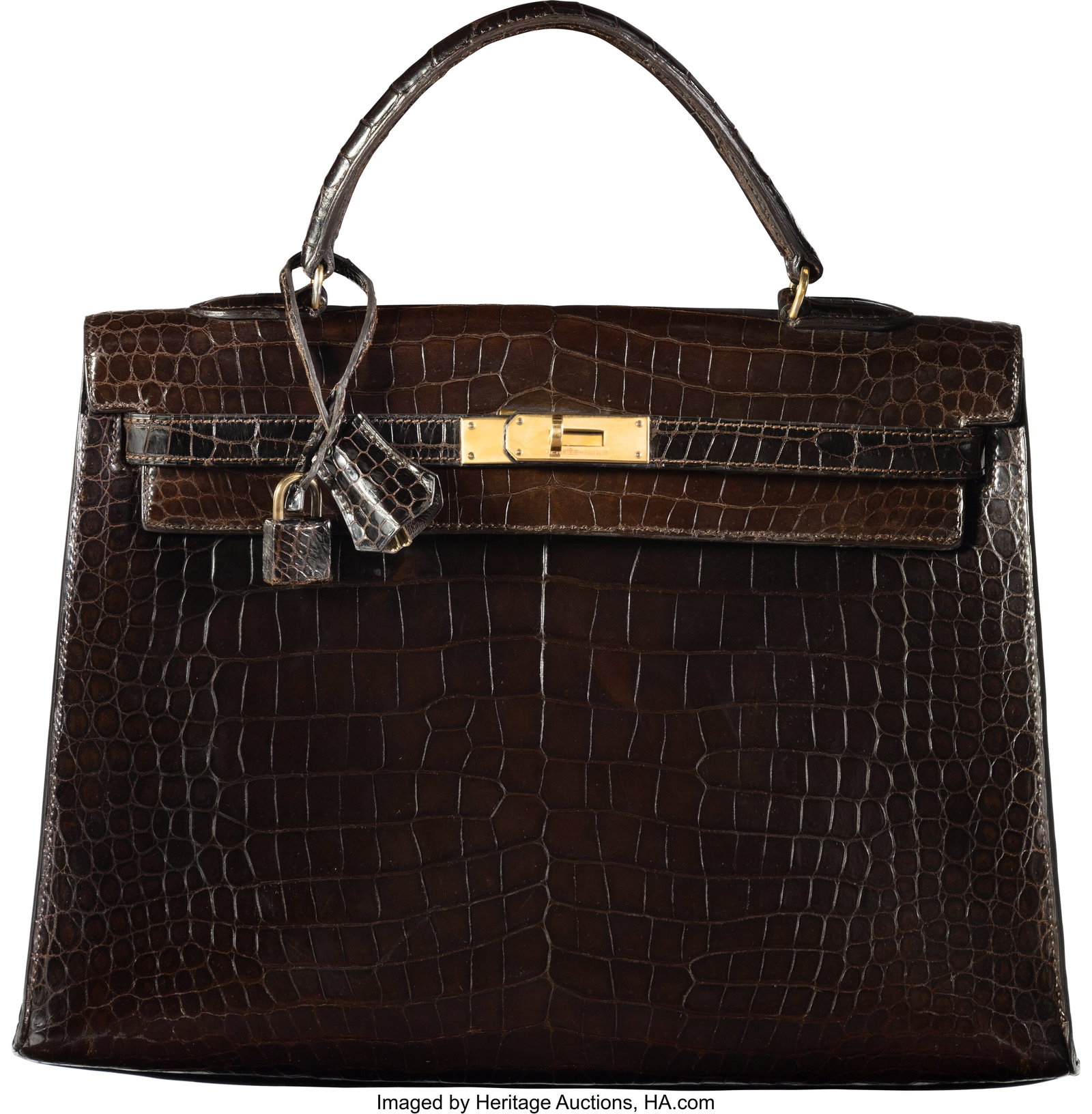 Hermès Vintage 35cm Marron Fonce Shiny Crocodil: Hermès Vintage 35cm Marron Fonce Shiny Crocodile Sellier Kelly Bag with Gold Hardware L Circle, 1982 Condition: 3 14" Width x 10" Height x 5" Depth This bag is done in Marron Fonce