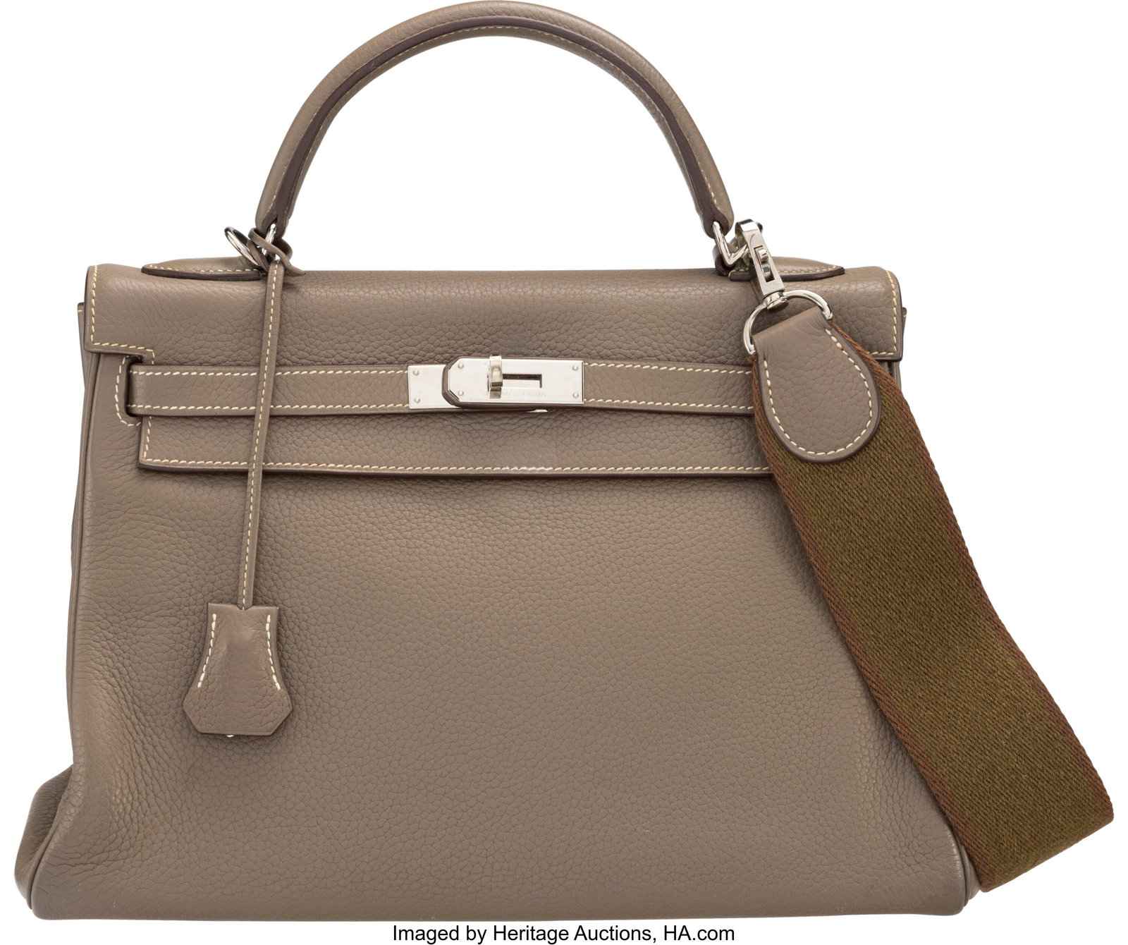 Hermès 32cm Etoupe Clemence Leather Kelly Retou: Hermès 32cm Etoupe Clemence Leather Kelly Retourne Bag with Palladium Hardware N Square, 2010 Condition: 3 12.5" Width x 8" Height x 4.5" Depth This bag is done in Eto