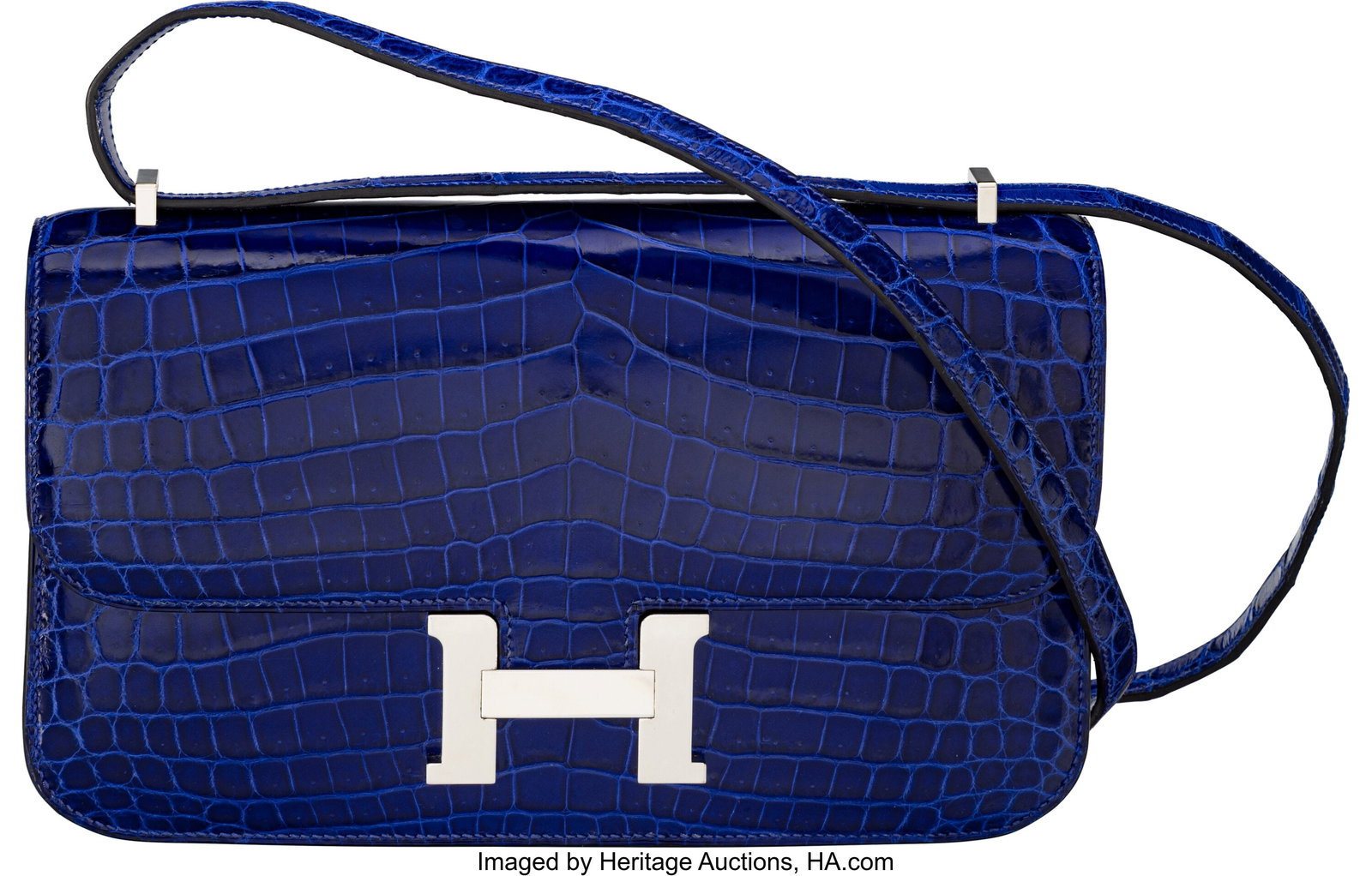 Hermès Shiny Bleu Electrique Niloticus Crocodil: Hermès Shiny Bleu Electrique Niloticus Crocodile Constance Elan Bag with Palladium Hardware P Square, 2012 Condition: 3 9.5" Width x 6" Height x 2" Depth This bag is done in