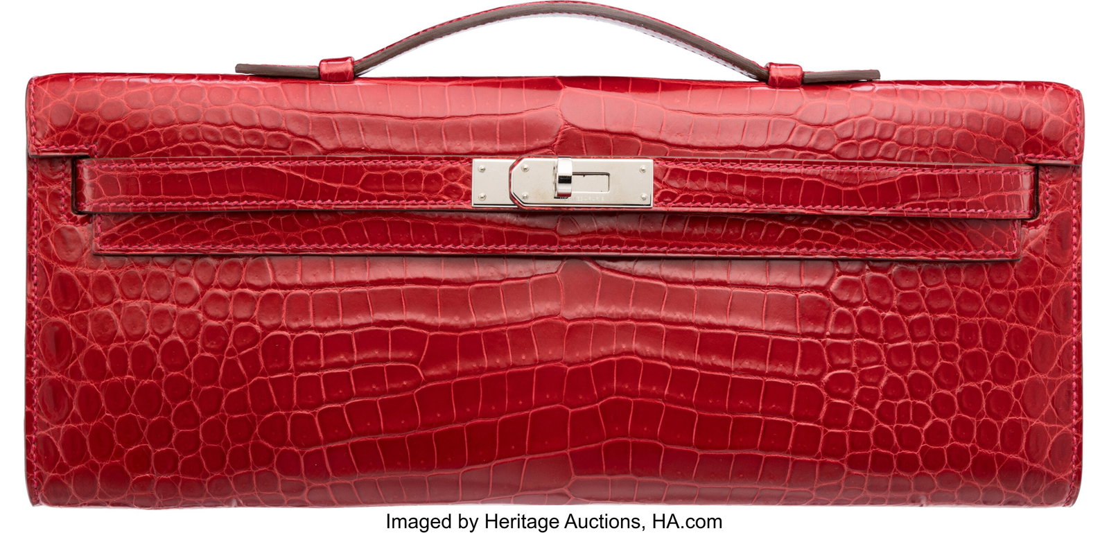 Hermès Shiny Braise Porosus Crocodile Kelly Cut: Hermès Shiny Braise Porosus Crocodile Kelly Cut Clutch with Palladium Hardware T, 2015 Condition: 3 12.25" Width x 5" Height x 1" Depth This bag is done in Braise Porosus Cro