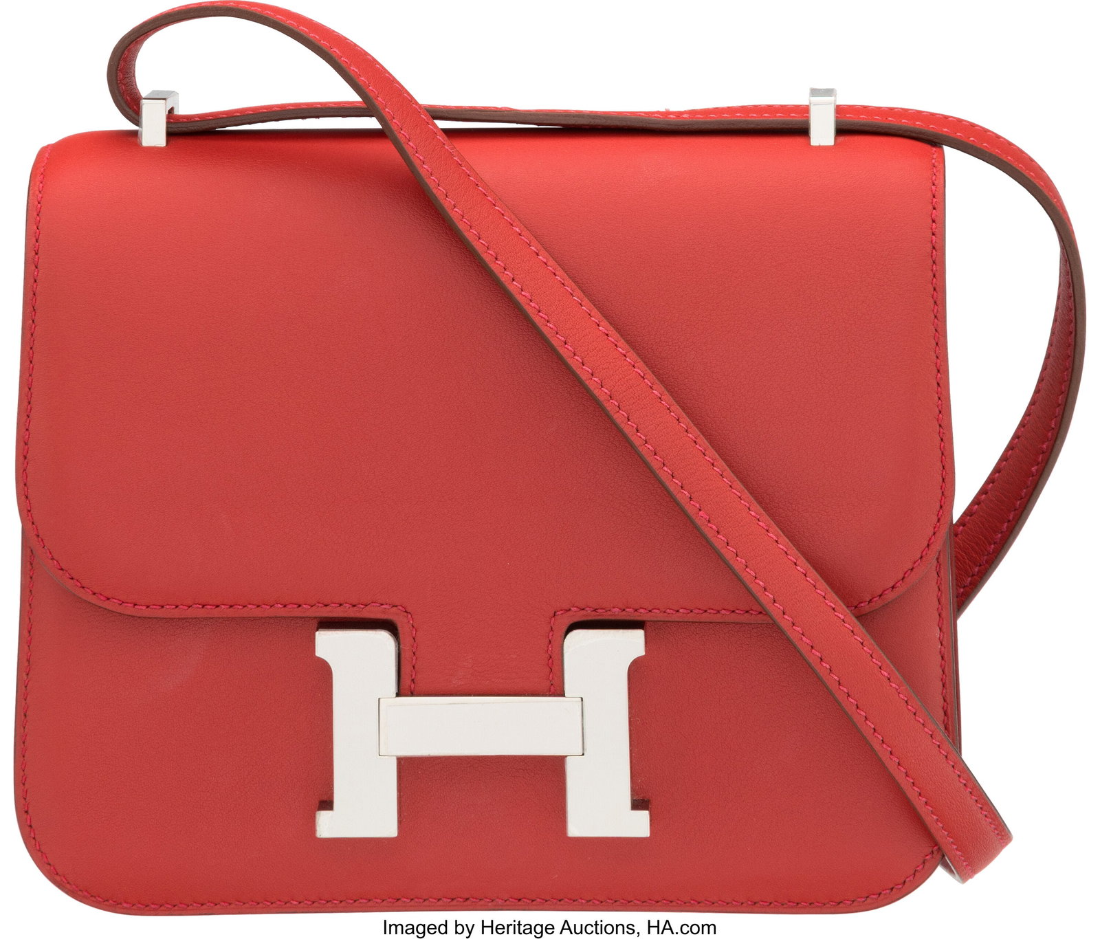 Hermès 18cm Rouge Vif Swift Leather Mini Consta: Hermès 18cm Rouge Vif Swift Leather Mini Constance Bag with Palladium Hardware T, 2015 Condition: 2 7.25" Width x 6" Height x 1.5" Depth This bag is done in Rouge Vif