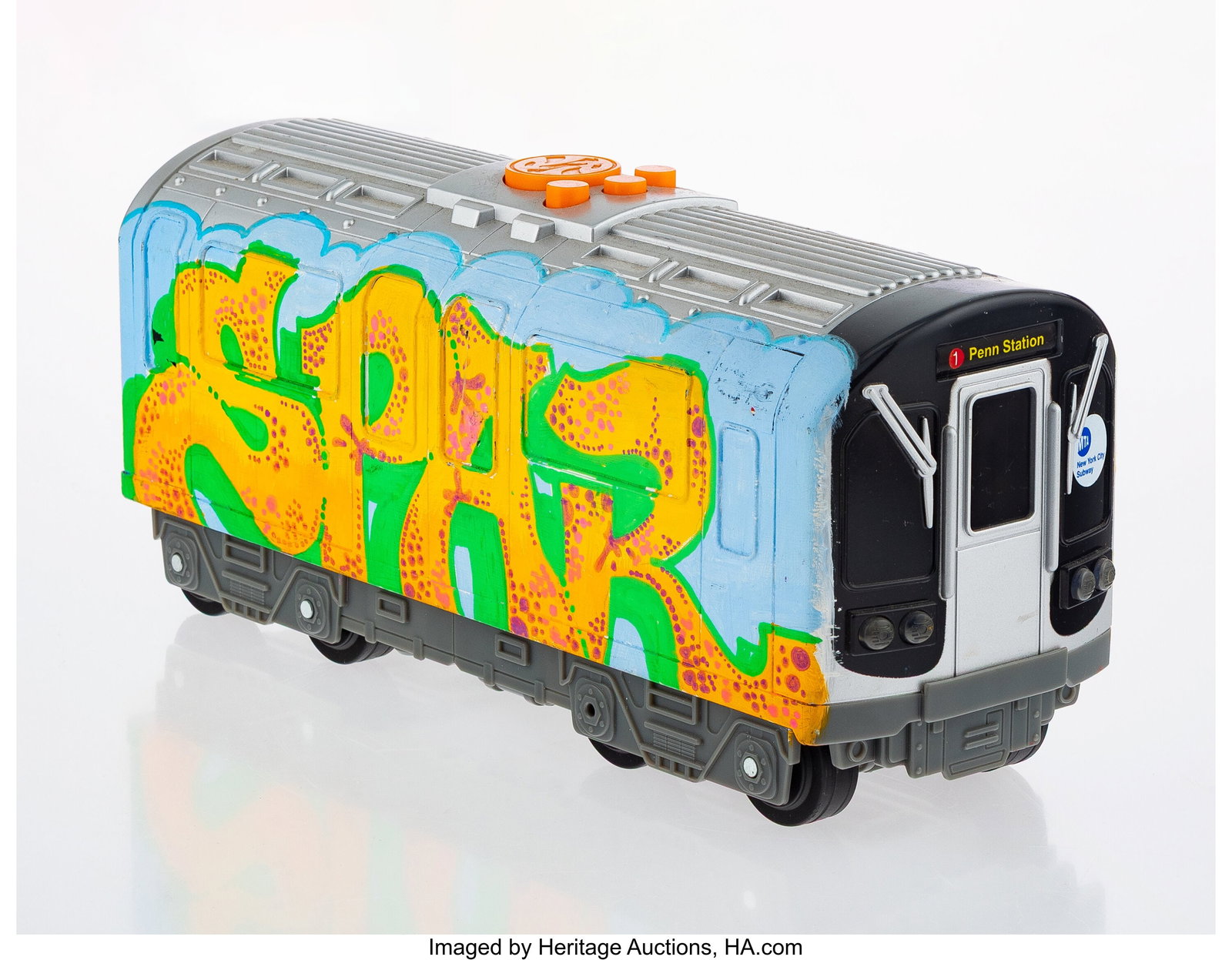 LA II (b. 1967) Untitled (Train Car) Ink on plas: LA II (b. 1967) Untitled (Train Car) Ink on plastic train car toy 4 x 11 x 6 inches (10.2 x 27.9 x 15.2 cm) Signed on the reverse: LA2 &