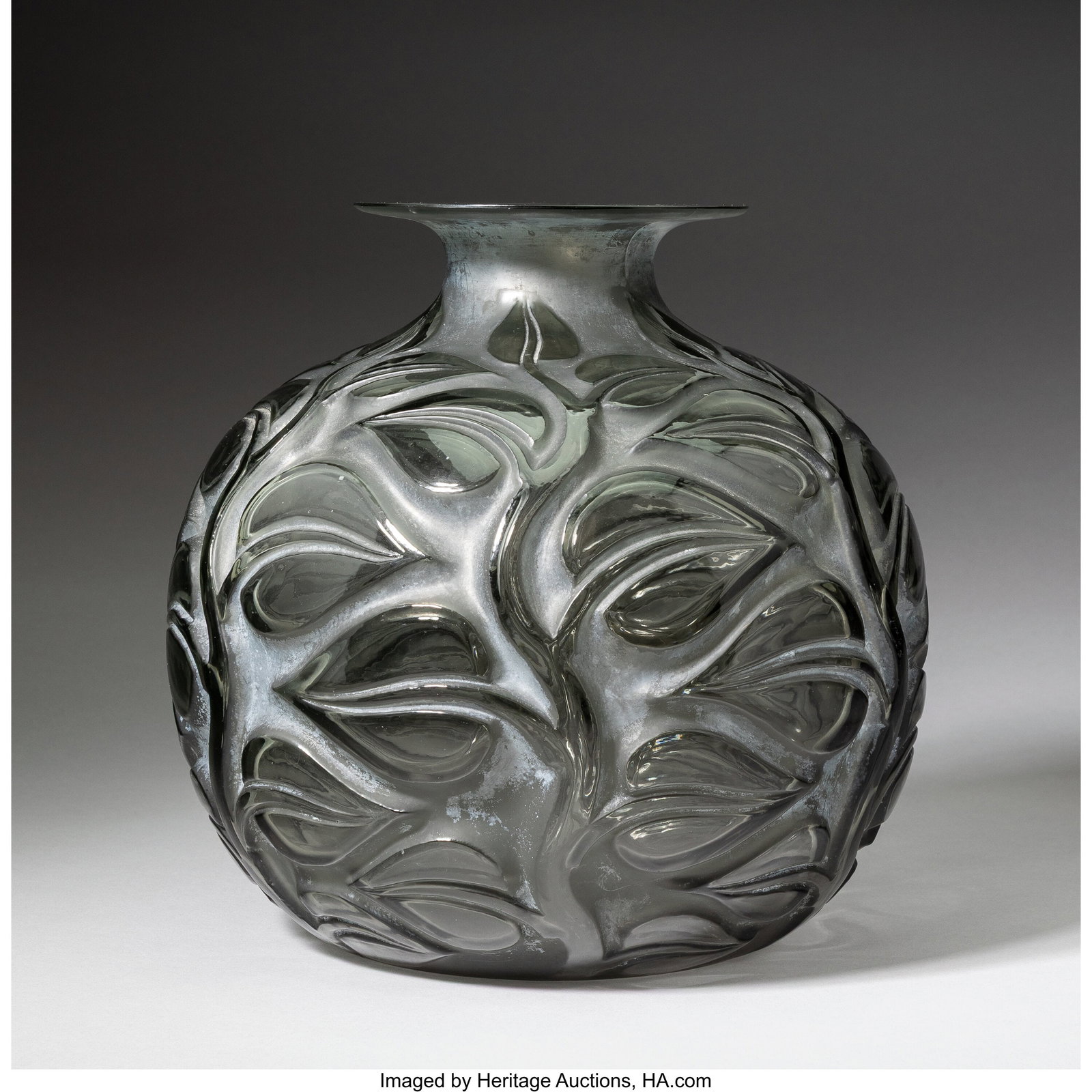 René Lalique Sophora Vase, circa 1926 Topaz gla: René Lalique Sophora Vase, circa 1926 Topaz glass with white patina 10-1/4 inches (26 cm), M.p. 434, no. 977. Marks: R.