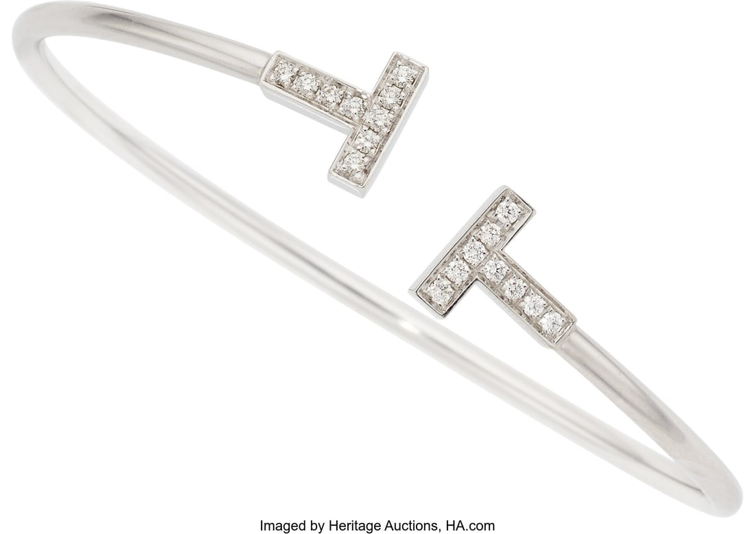 Tiffany & Co. Diamond, White Gold Bracelet Ston: Tiffany & Co. Diamond, White Gold Bracelet Stones: Full-cut diamonds weighing a total of 0.24 carat Metal: 18k white gold Marked: T&Co. Collection&