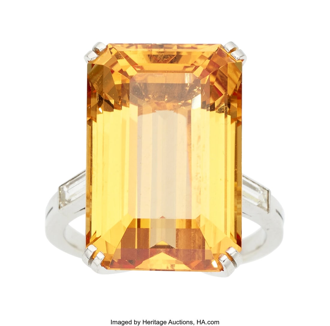 Topaz, Diamond, Platinum Ring Stones: Emerald-c: Topaz, Diamond, Platinum Ring Stones: Emerald-cut topaz weighing approximately 23.50 carats; baguette-cut diamonds weighing a total of approximately 0.60 carat Met