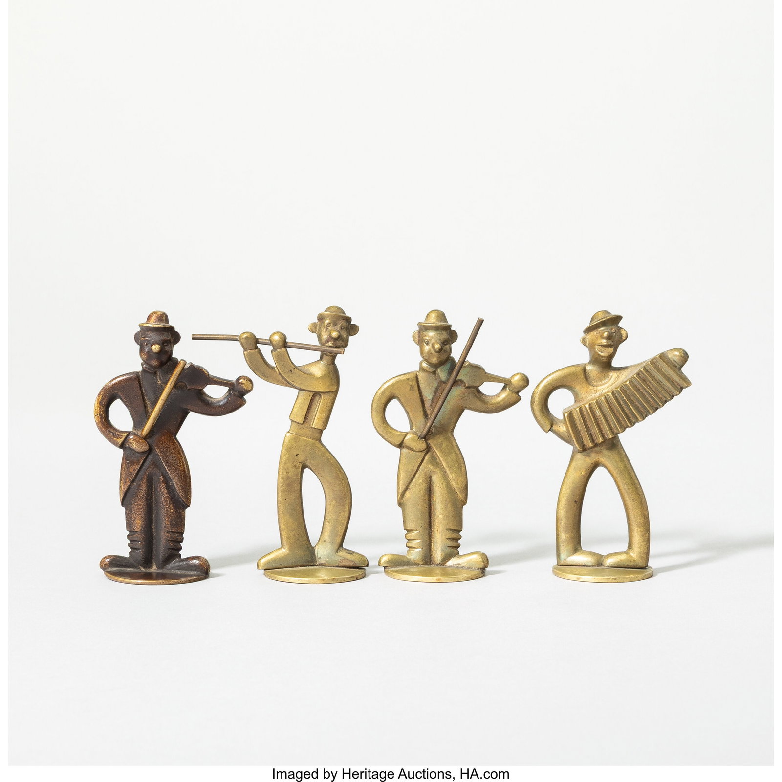 Style of Hagenauer Werkstätte Four Musicians, 20th centu: Style of Hagenauer Werkstätte Four Musicians, 20th century Brass, patinated bronze 3-1/8 x 2 x 1-1/8 inches (7.9 x 5.1 x 2.9 cm) (each, approximately) HID03101062020 © 2026 Heritage Auctions | All R