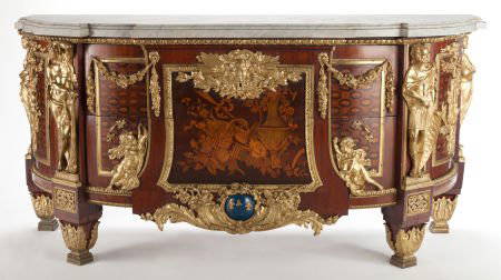 A LOUIS XVI-STYLE GILT BRONZE, MAHOGANY INLAID C: A LOUIS XVI-STYLE GILT BRONZE, MAHOGANY INLAID COMMODE AFTER THE MODEL BY JEAN-HENRI RIESENER France, circa 190033 x 52-1/2 x 24 inches (83.8 x 133.4 x 61.0 cm) The commode with