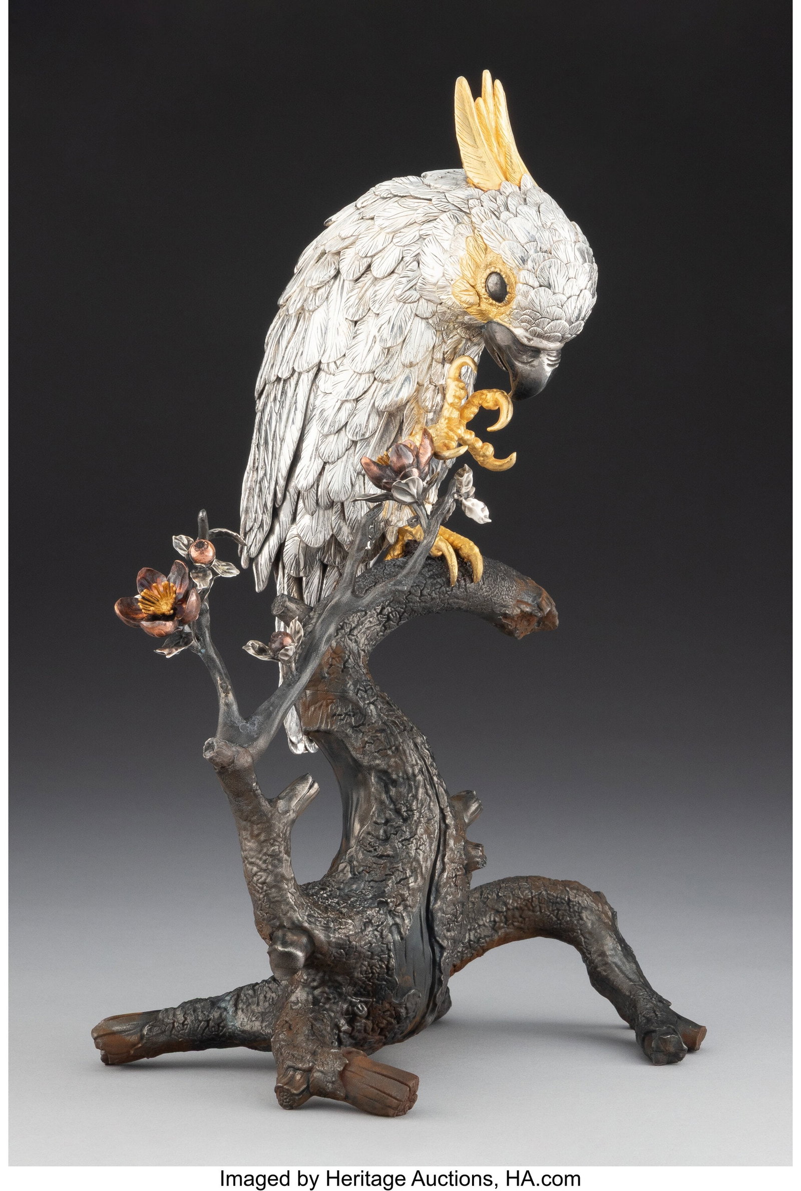 A Japanese Silver & Mixed Metal Cockatoo on Bron: A Japanese Silver & Mixed Metal Cockatoo on Bronze Branch-Form Base Marks: (undeciphered), (two-character mark) 12-1/4 x 8-1/4 x 6 inches (31.1 x 21.0 x 15.2 cm) 1646 grams (gross) HID03101062020 © 2
