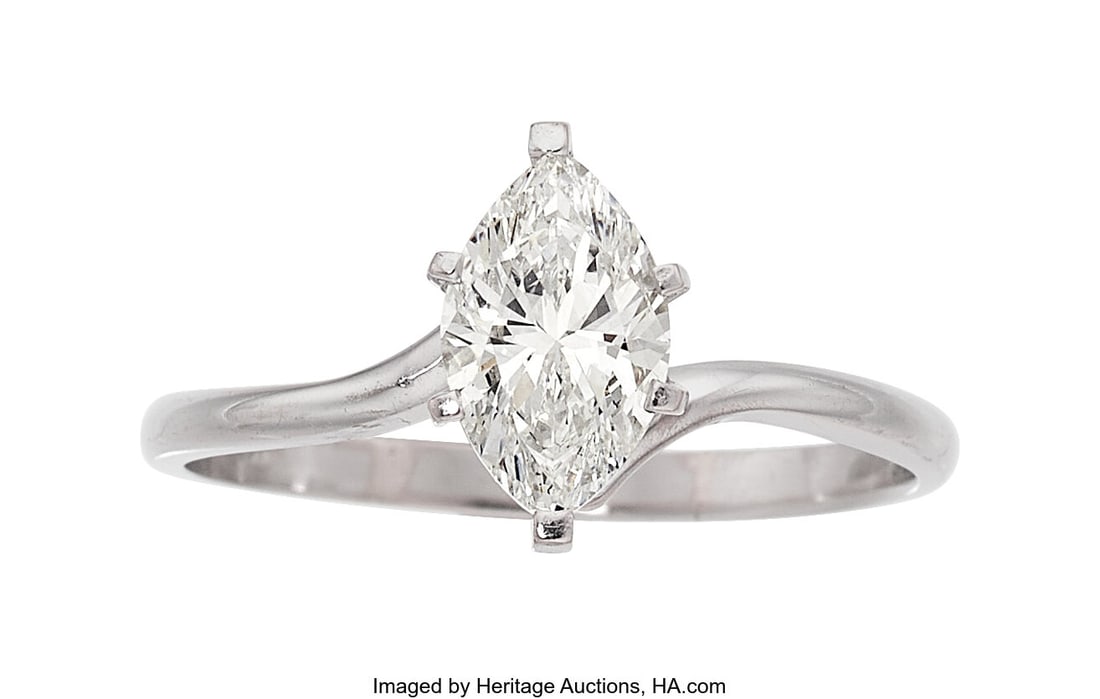 Diamond, White Gold Ring Stones: Marquise-shape: Diamond, White Gold Ring Stones: Marquise-shaped diamond weighing 1.50 carats Metal: 10k white gold Gross Weight: 3.10 grams Size: 10-3/4 (sizeable