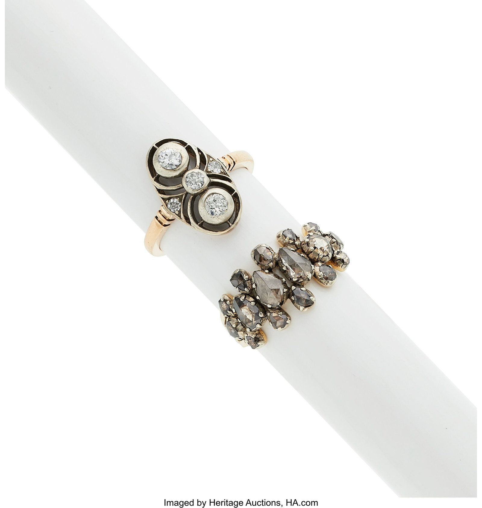 Antique Diamond, Silver-Topped Gold Rings Stone: Antique Diamond, Silver-Topped Gold Rings Stones: European-cut diamonds weighing a total of approximately 0.50 carat; rose-cut diamonds Metal: 14k gold; 10k silver-t