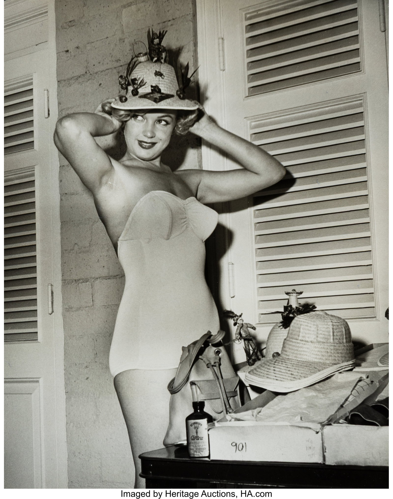 Art Weissman (American, 20th Century) Marilyn Mo: Art Weissman (American, 20th Century) Marilyn Monroe putting on a Hat; Marilyn Monroe with Milton Green (2 works), 1950s Gelatin silver prints, ferrotyped 10