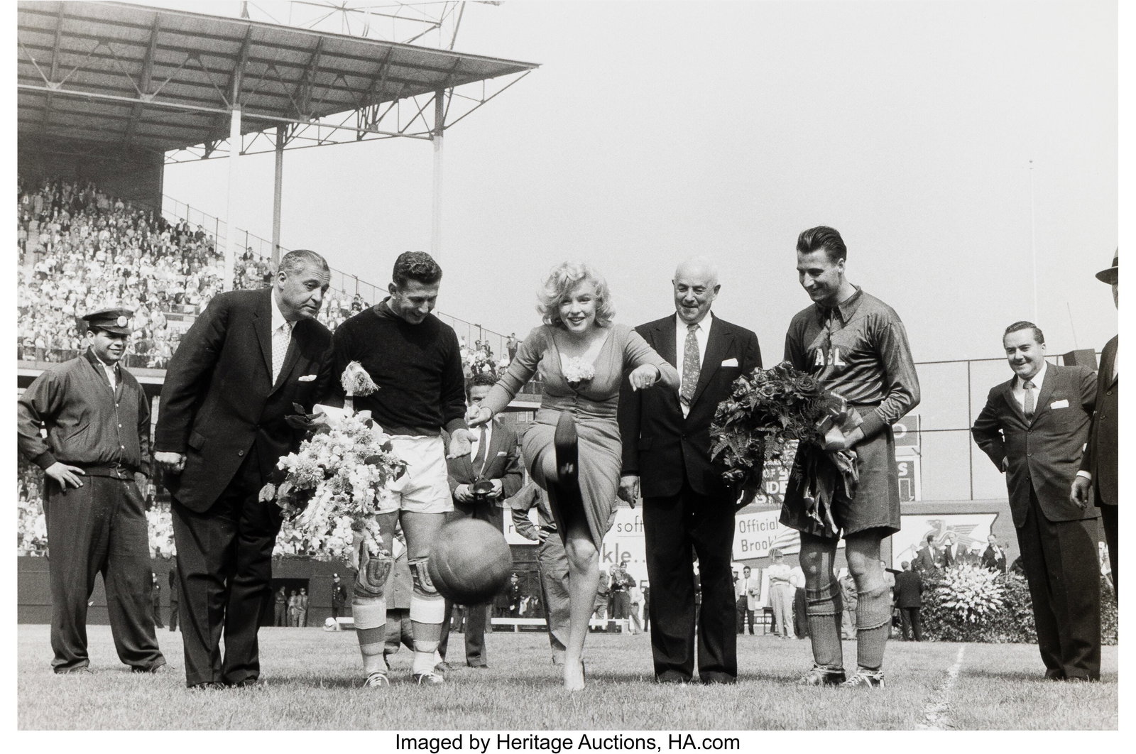 Sam Shaw (American, 1912-1999) Marilyn Monroe Ki: Sam Shaw (American, 1912-1999) Marilyn Monroe Kicks Off a Soccer Match at Ebbets Field, 1957 Gelatin silver print, printed later 9 x 13-3/8 inches (22.9 x 3