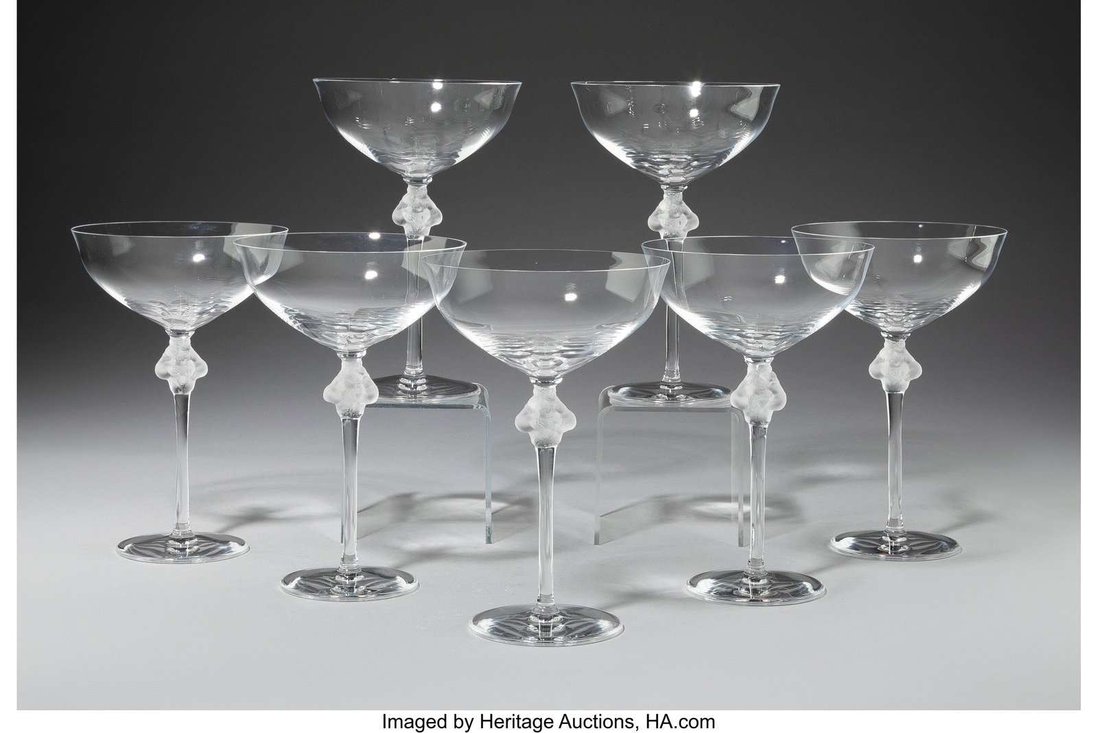 Lalique Set of Seven Roxane Champagne Coupes, po: Lalique Set of Seven Roxane Champagne Coupes, post-1945 Clear and frosted glass 6-3/4 inches (17.1 cm) (each) Marks: Lalique France Property from the