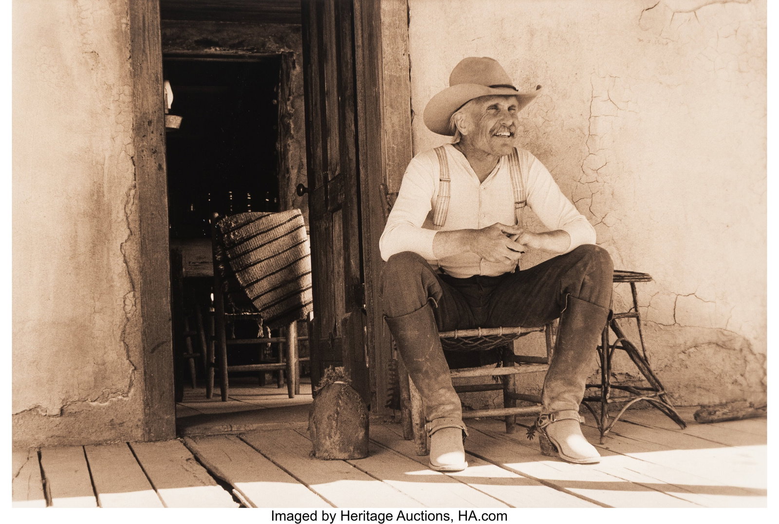 William Wittliff (American, 1940-2019) Gus on Po: William Wittliff (American, 1940-2019) Gus on Porch: Lonesome Dove, circa 1989 Toned gelatin silver print 12-1/2 x 18-7/8 inches (31.8 x 47.9 cm&