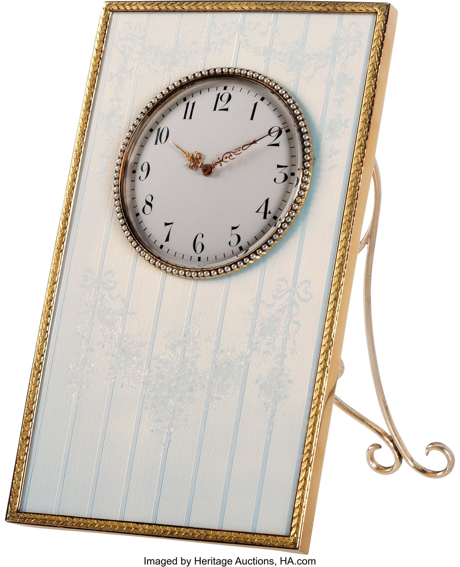 Marilyn Monroe: A Fabergé Pearl-Set Two-Color G: Marilyn Monroe: A Fabergé Pearl-Set Two-Color Gold and Gilt Silver-Mounted Opalescent White Guilloché Enamel Table Clock. Fabergé, Workmaster Henrik Wigströ