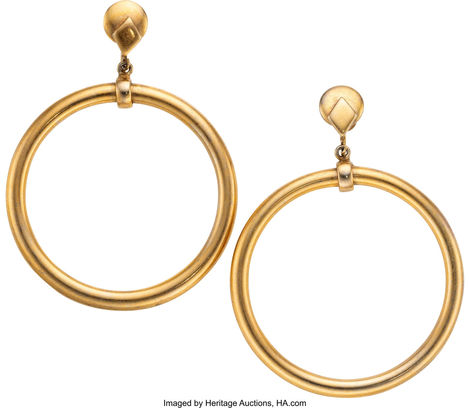 Marilyn Monroe Personal Hoop Earrings. Vintage : Marilyn Monroe Personal Hoop Earrings. Vintage original pair of hoop earrings from Marilyn Monroe's personal collection composed of large gold-toned circular hoops with geometric screwback fitt