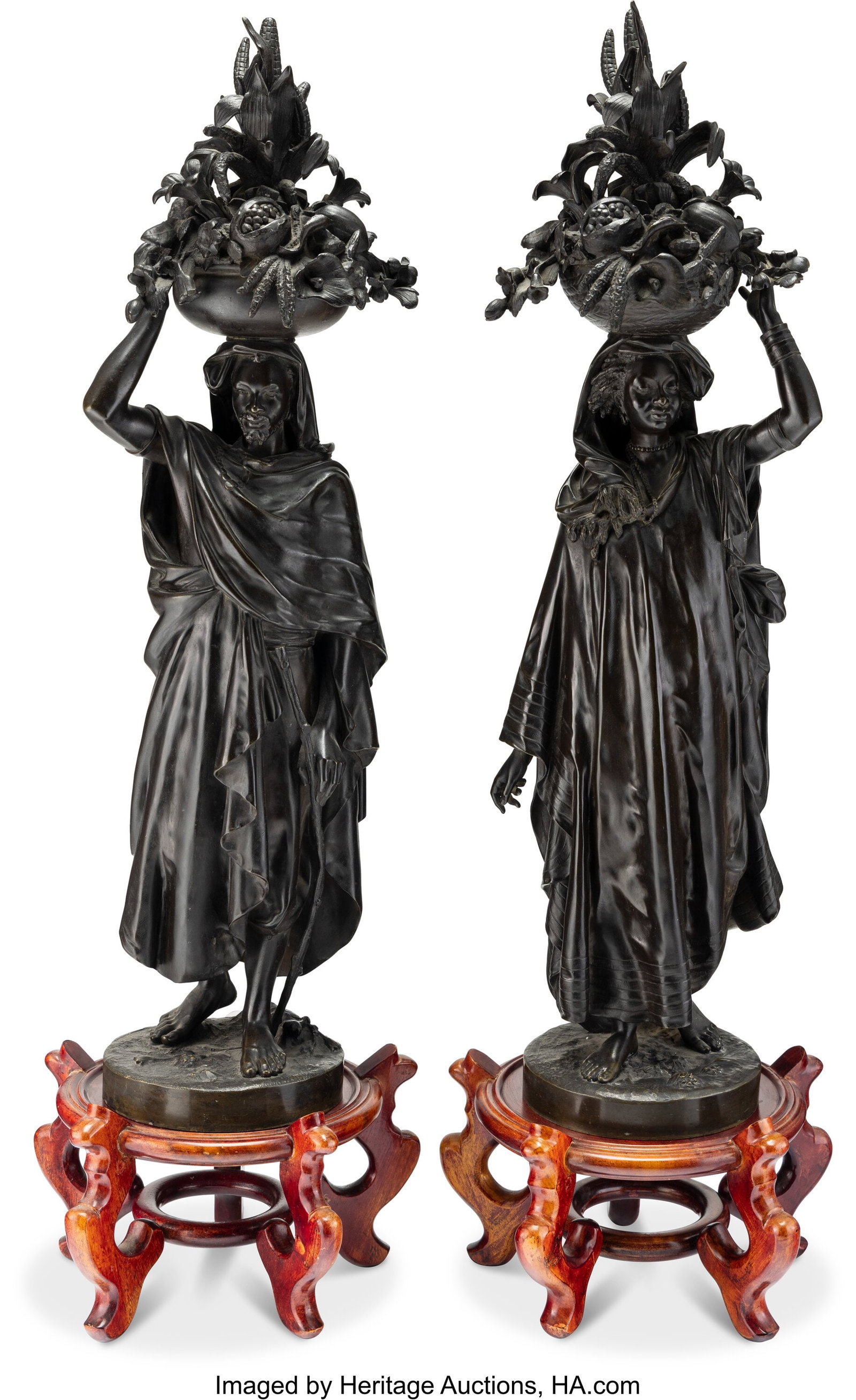 A Pair of Patinated Bronze Figures in the Manner (1 of 4)