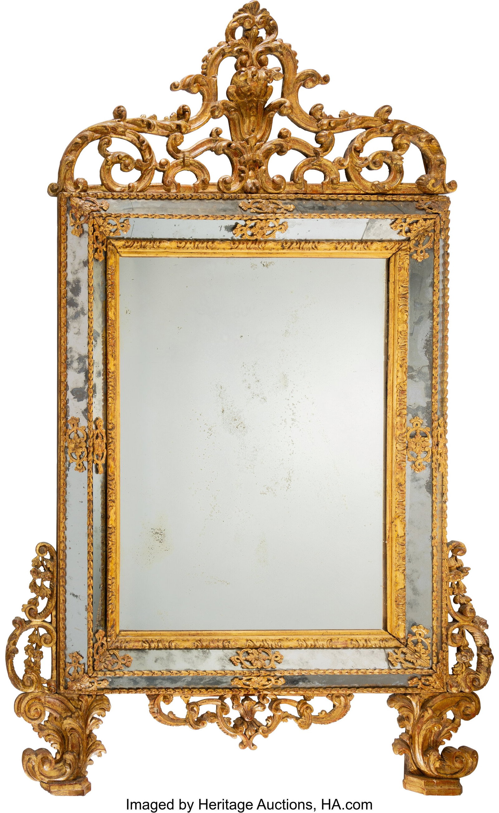 A Continental Carved Giltwood Mirror, first quar: A Continental Carved Giltwood Mirror, first quarter 18th century 82-5/8 x 53-1/8 inches (210 x 135 cm) PROVENANCE: Sotheby's, London, Important Continental Fu