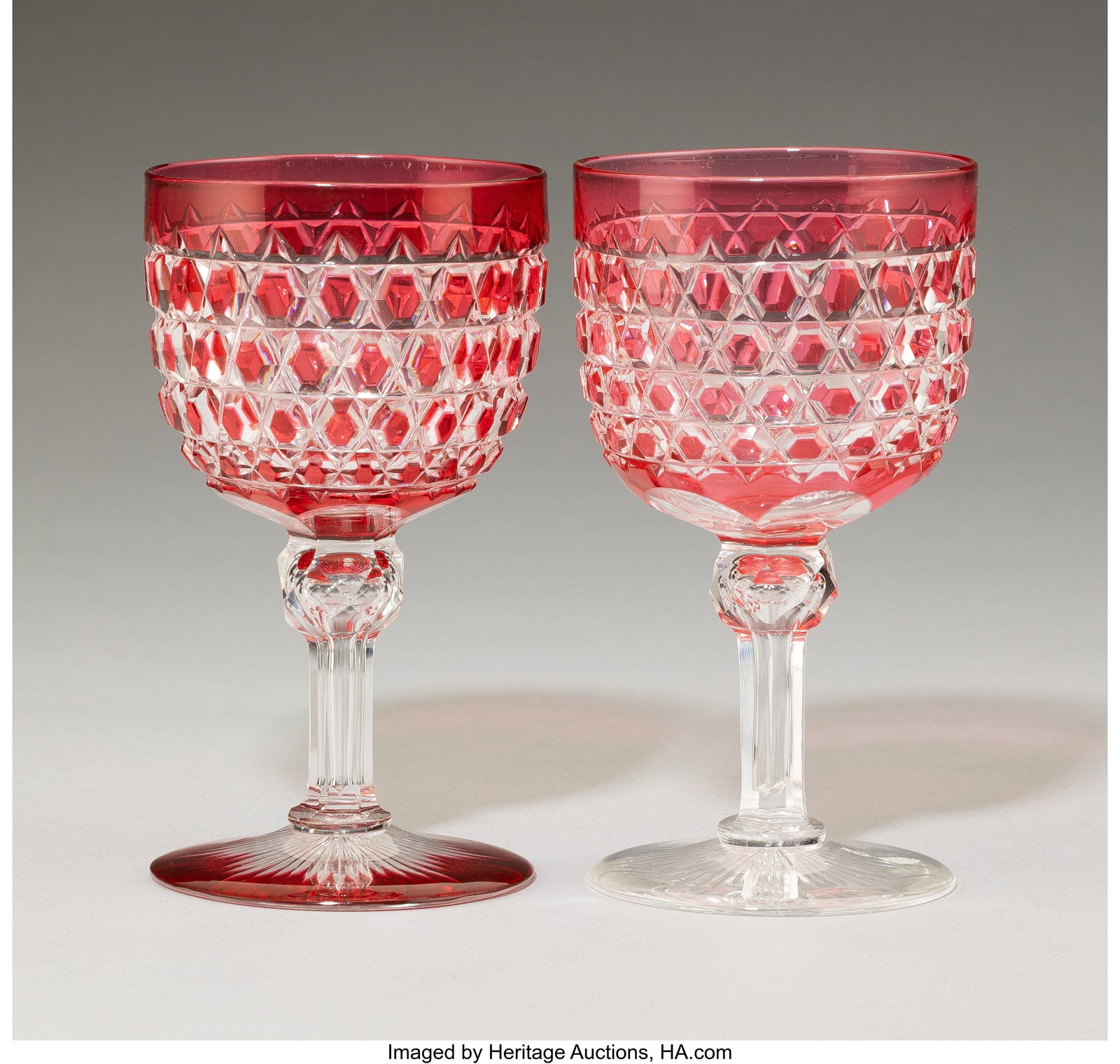 A Set of Sixteen Cranberry Cut Glass Wine Stems,: A Set of Sixteen Cranberry Cut Glass Wine Stems, late 19th/ early 20th century 4-3/4 x 2-5/8 x 2-5/8 inches (12.1 x 6.7 x 6.7 cm) (each) 