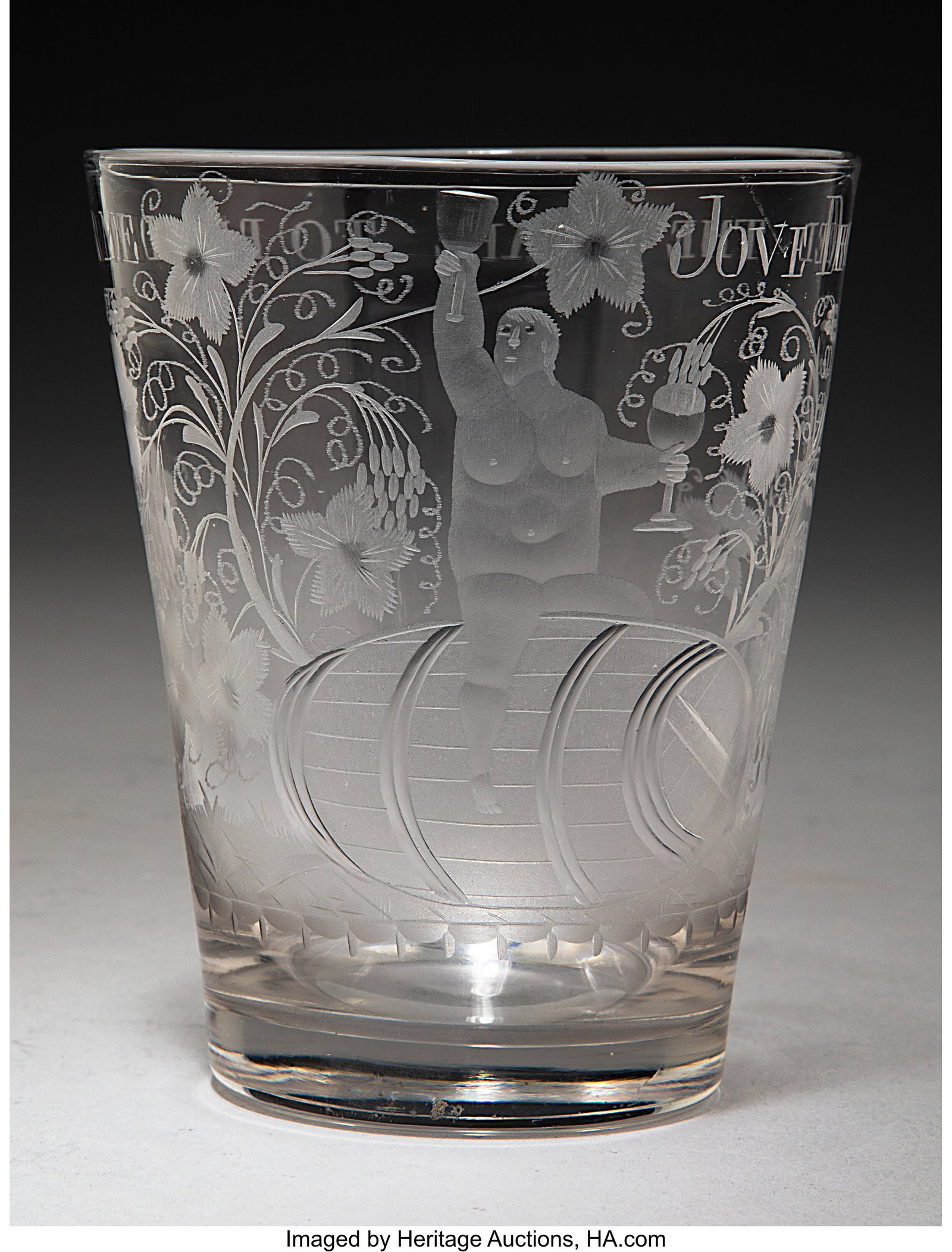 A British Engraved Free-Blown Glass Beaker, earl: A British Engraved Free-Blown Glass Beaker, early 19th century 1-3/4 x 3-3/4 x 3-3/4 inches (4.4 x 9.5 x 9.5 cm) PROVENANCE: Collection of J&peri