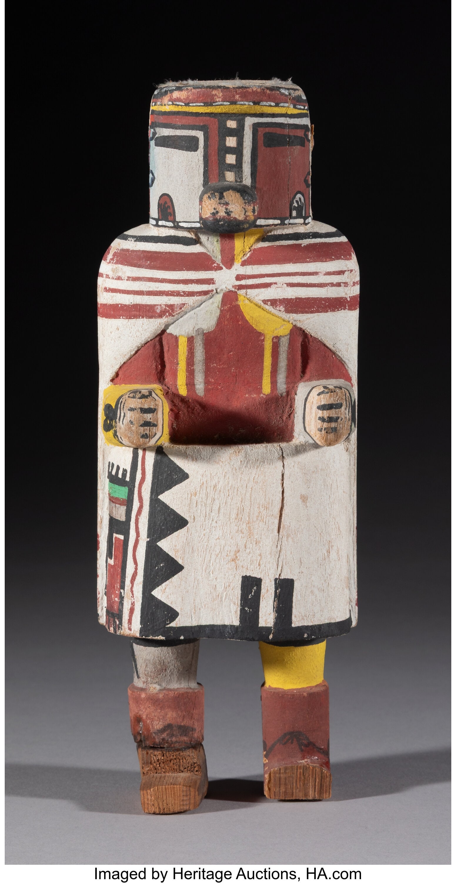 A Hopi Katsina Doll c. 1949 cotton wood, pigme: A Hopi Katsina Doll c. 1949 cotton wood, pigments, remnants of cotton string This lot is accompanied by a hand-written note, which states in part: Carved by Chief Tewa's
