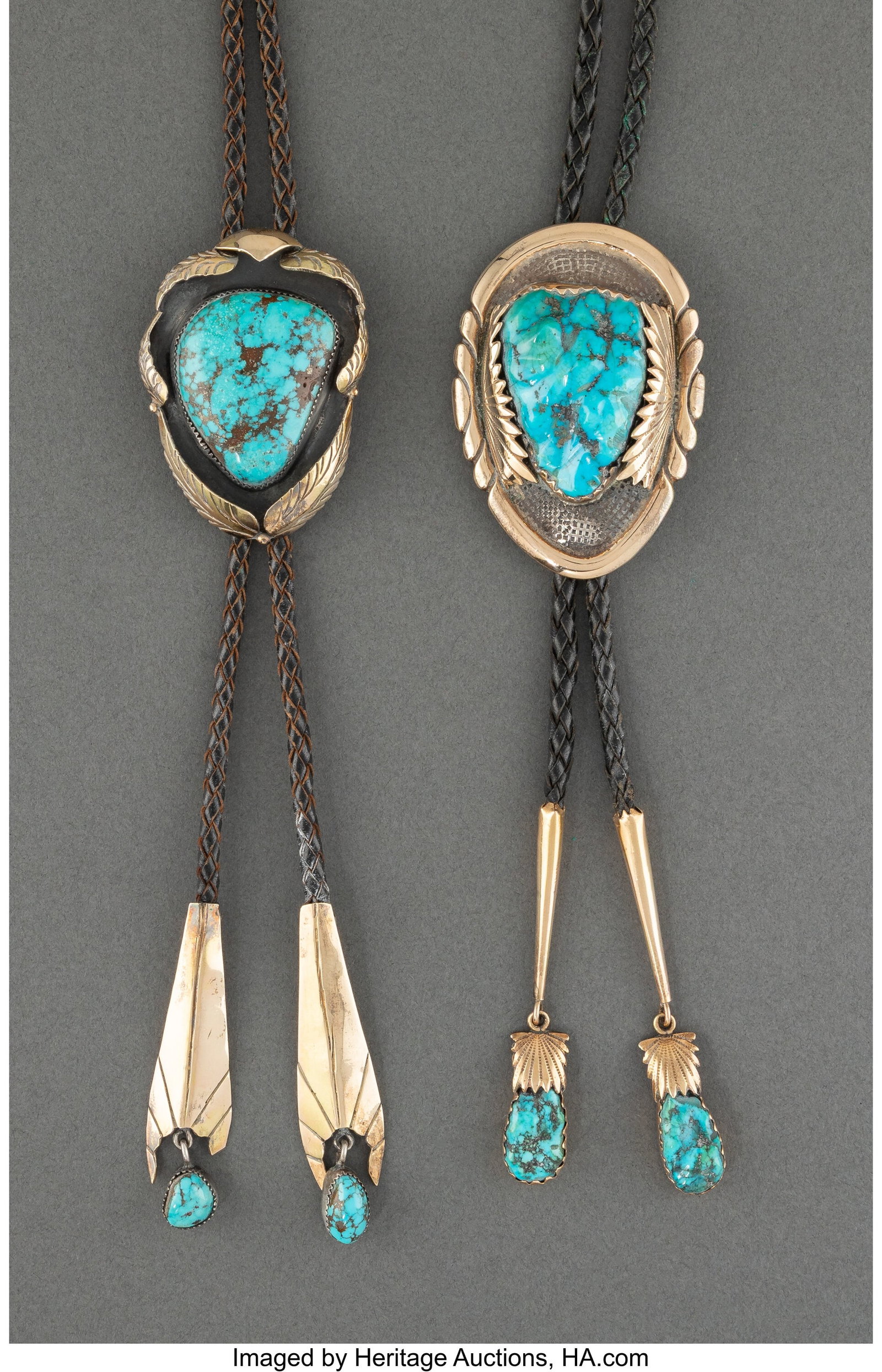 Two Navajo Gold Bolo Ties c. 1980 silver, gold: Two Navajo Gold Bolo Ties c. 1980 silver, gold overlay, turquoise Lengths of slides: 2 &frac12; and 3 inches HID03101062020 © 2026 Heritage Auctions | All R