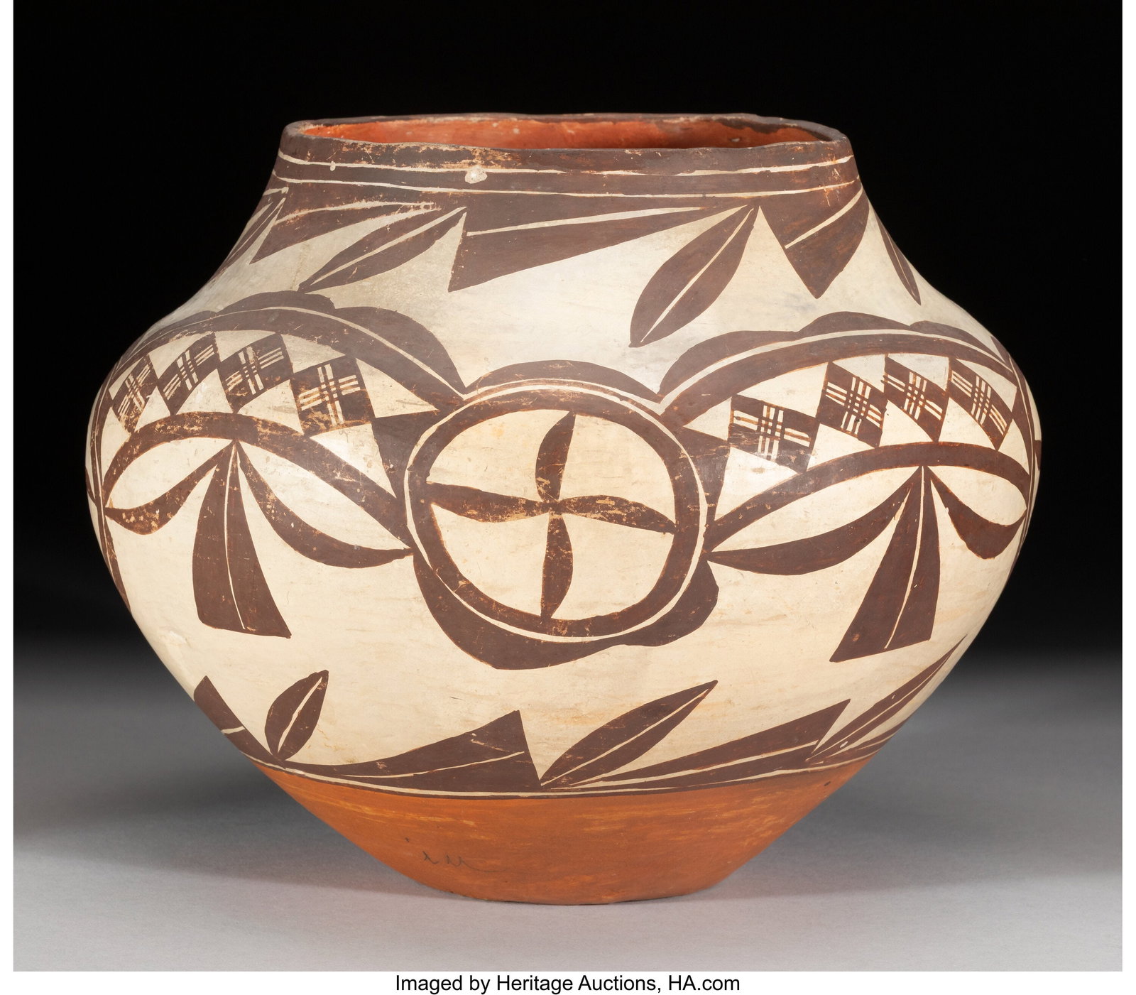 An Acoma Polychrome Jar c. 1900 with paper ta: An Acoma Polychrome Jar c. 1900 with paper tag affixed to the bottom, inscribed From Jake Gold, Dealer in Indian and Mexican Curiosities, Santa Fe, N. M. c