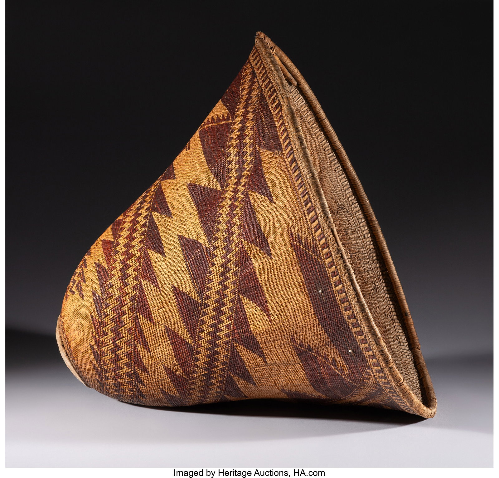 A Pomo Twined Burden Basket c. 1890 willow, re: A Pomo Twined Burden Basket c. 1890 willow, redbud, hide, glass pony beads, fibrous string Provenance: A Private Collection, New York, NY,
