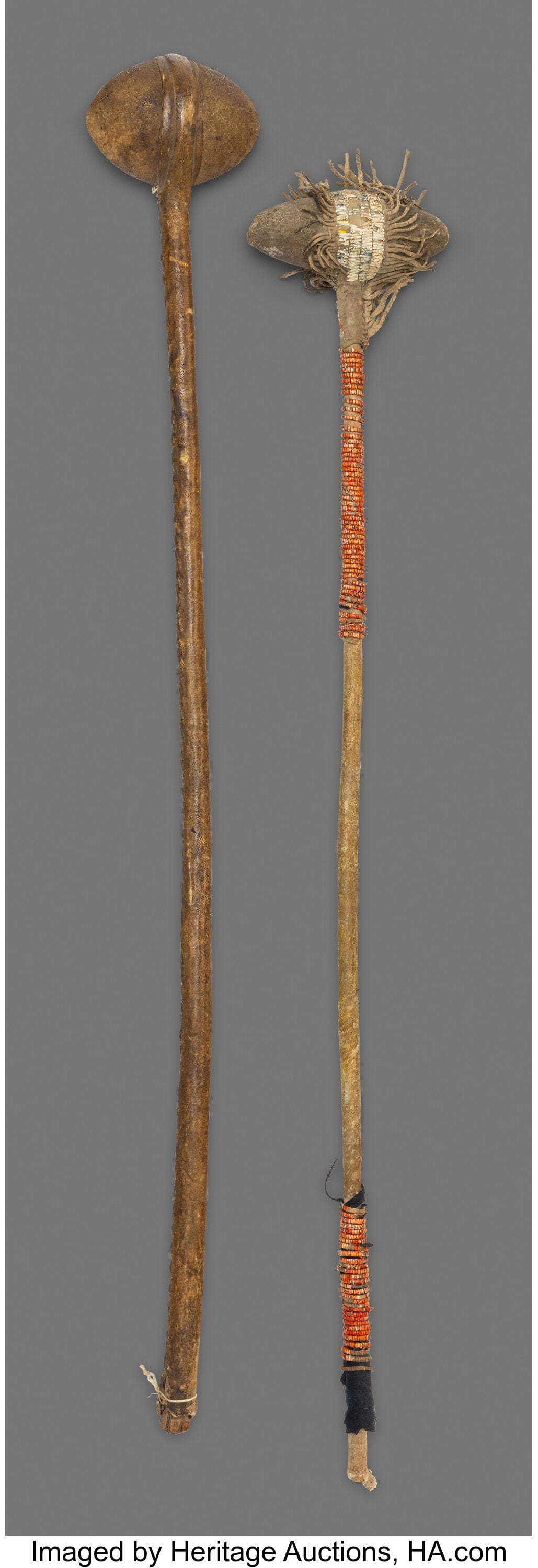 Two Plains Stone Head Clubs c. 1870 wood, hide: Two Plains Stone Head Clubs c. 1870 wood, hide, natural and dyed porcupine quills, navy blue wool trade cloth, sinew Lengths: 32 &frac12; and 34
