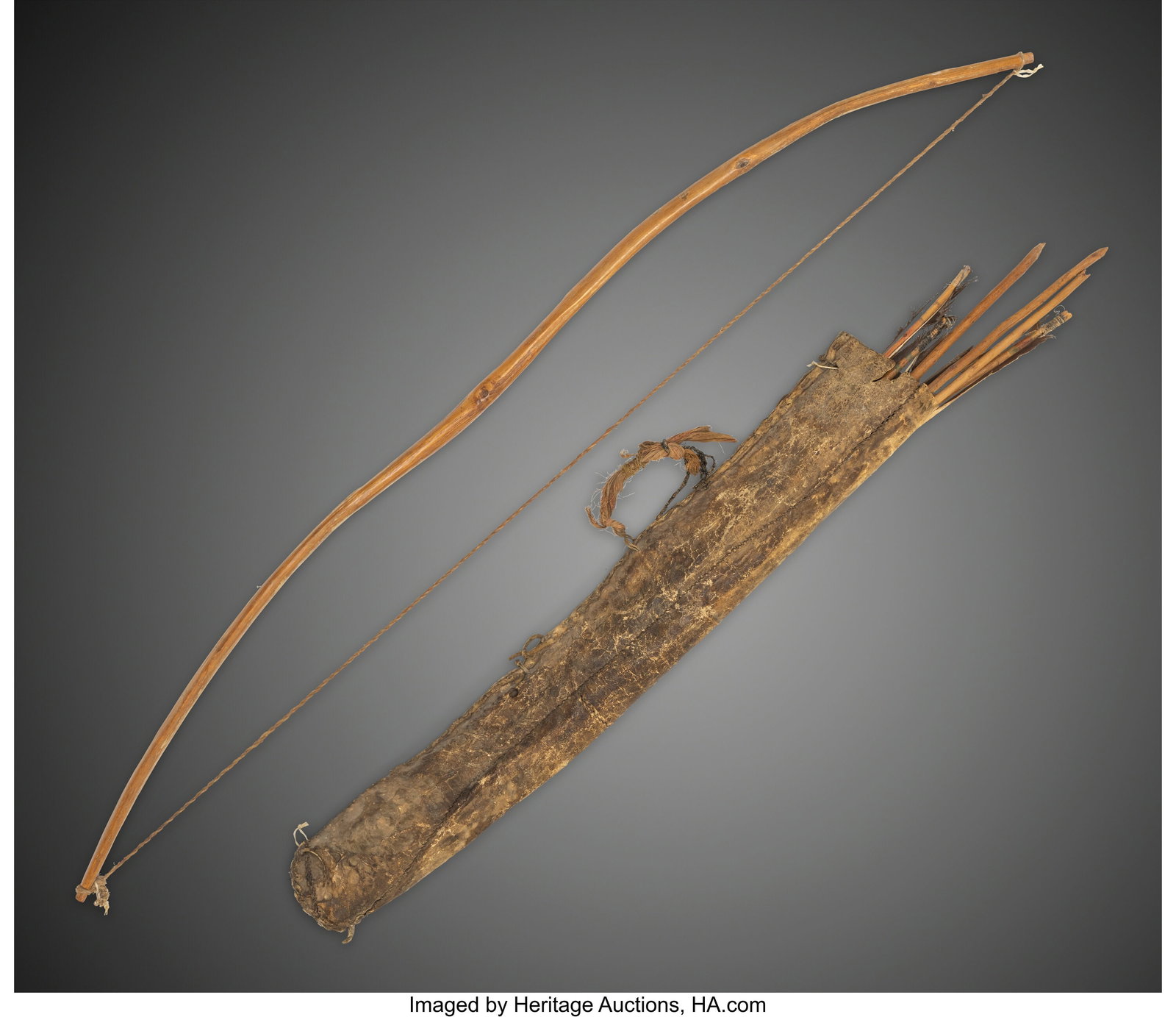 A Plains Buffalo Hide Quiver with Wood Bow and S (1 of 2)