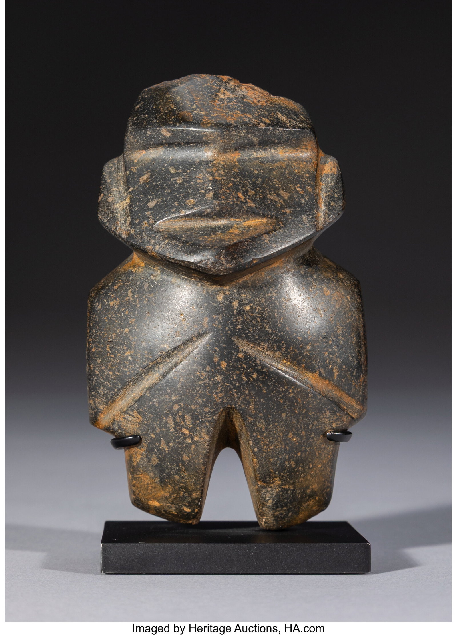A Mezcala Figure, Type M-8 Mexico, c. 300–100: A Mezcala Figure, Type M-8 Mexico, c. 300–100 BC A compact standing figure of M-8 type, carved in the abstract manner associated with classic Mezcala sculpture. T