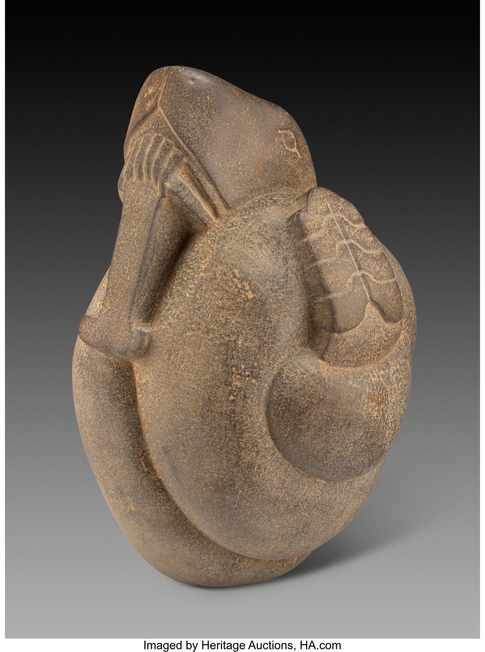 A Superb Aztec Serpent Central Mexico, c. 1300-1500 AD: A Superb Aztec Serpent Central Mexico, c. 1300–1500 AD Carved from fine-grained dense gray stone with a smooth surface, this serpent is coiled tightly upon itself in a compact, almost spherical form