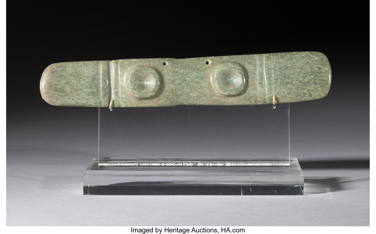 A Mesoamerican Jade Bar Pendant Mesoamerica, c.: A Mesoamerican Jade Bar Pendant Mesoamerica, c. 800–200 BC A finely worked jade pendant of thin, elongated spatulate form, with rounded ends and a subtle taper through t