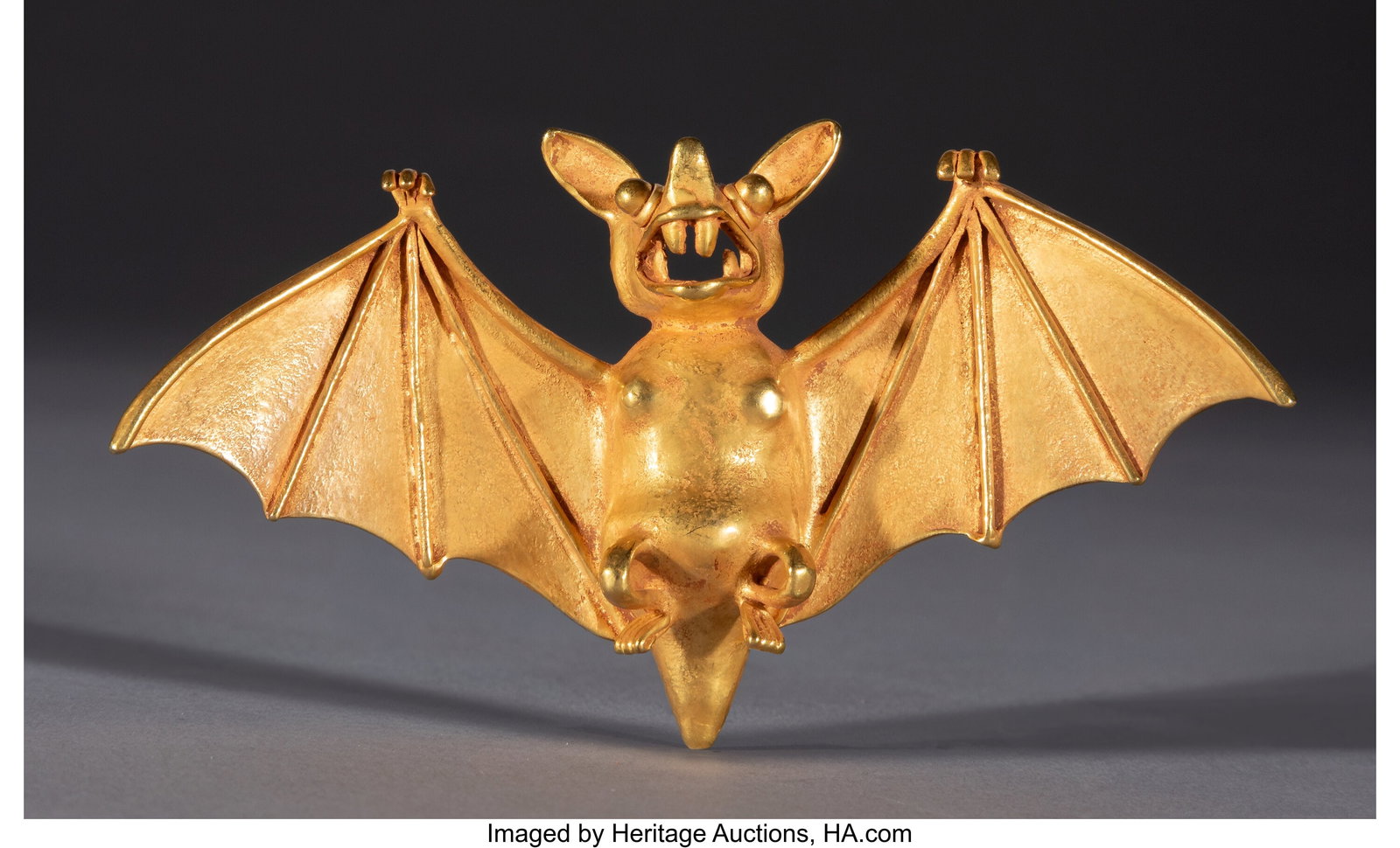 A Veraguas Gold Flying Bat Pendant Panama, poss: A Veraguas Gold Flying Bat Pendant Panama, possibly Costa Rica, c. 700–1500 AD Finely worked in a rich gold alloy, this highly expressive pendant depicts a bat in flight