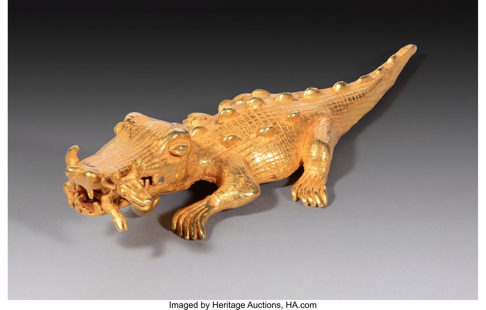 A Veraguas Gold Crocodile Pendant Panama, c. 70: A Veraguas Gold Crocodile Pendant Panama, c. 700–1500 AD Finely worked in rich gold alloy, this pendant takes the form of a crocodile with engraved lines across the body indic