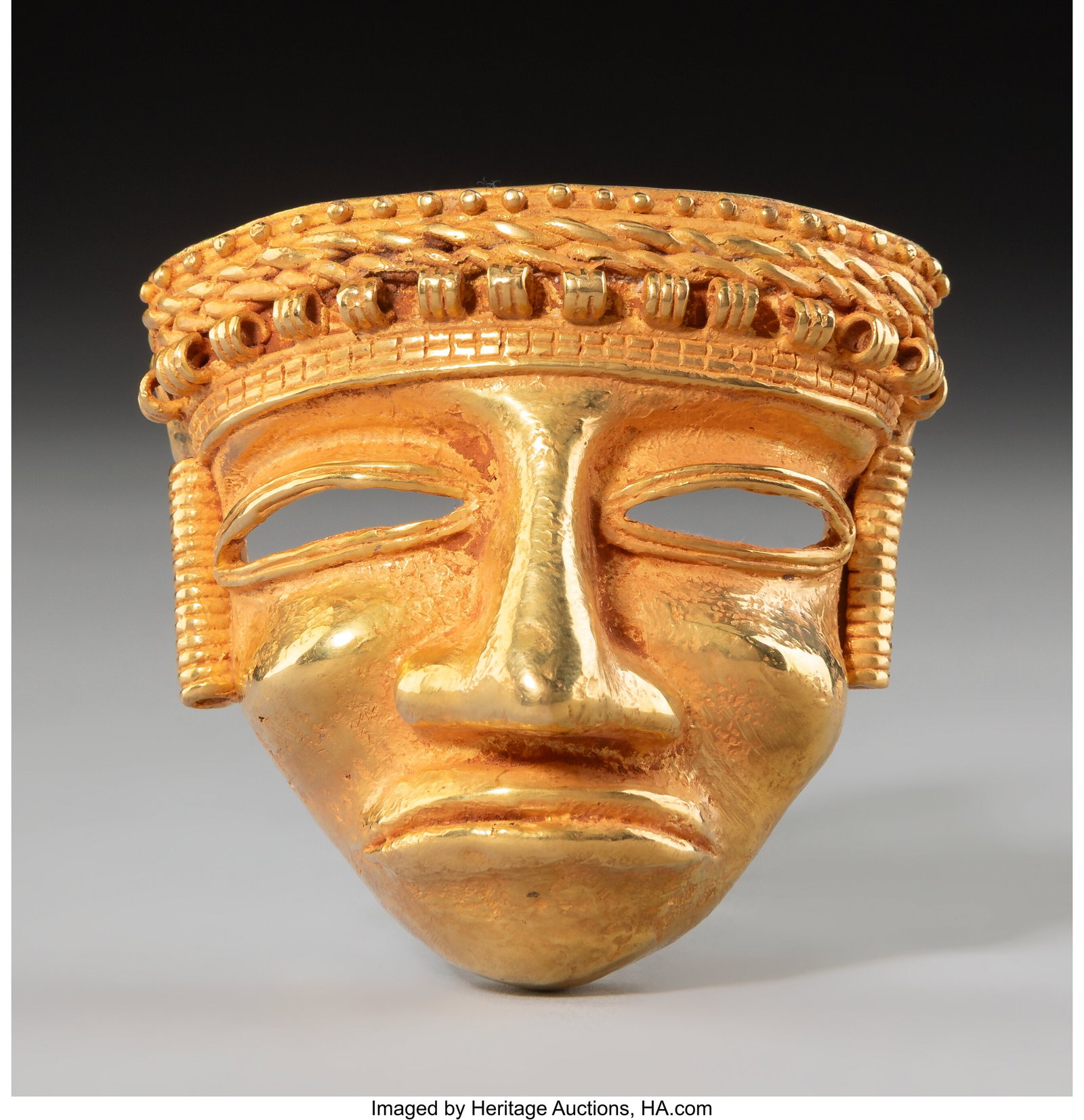 A Quimbaya Gold Head Pendant Colombia, c. 200-800 AD (1 of 4)