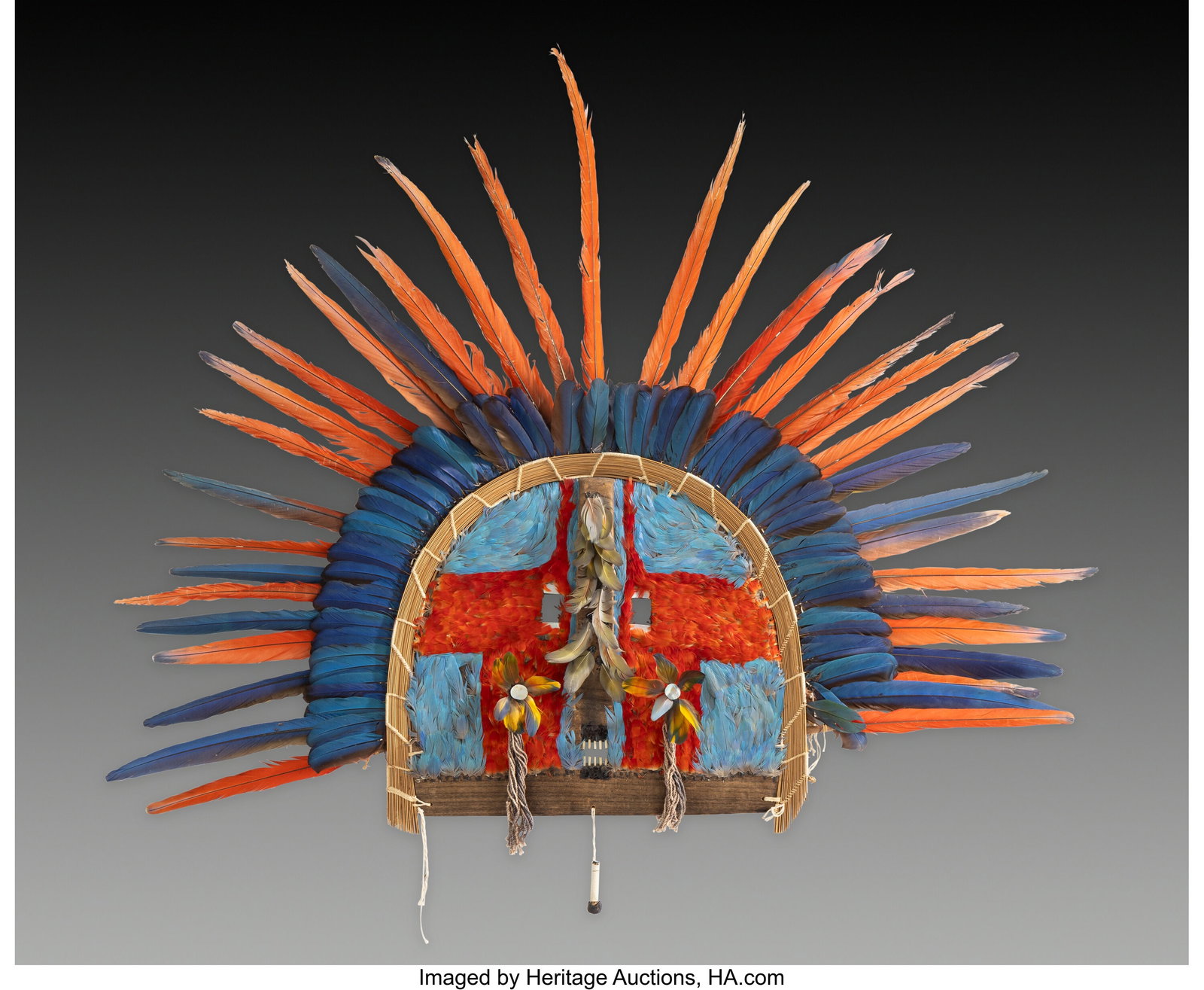 A Rare Double-Row Cara Grande Feather Mask Arag: A Rare Double-Row Cara Grande Feather Mask Araguaia region, Mato Grosso, Brazil, 20th century This spectacular cara grande mask is distinguished by its broad radiating arrangement of