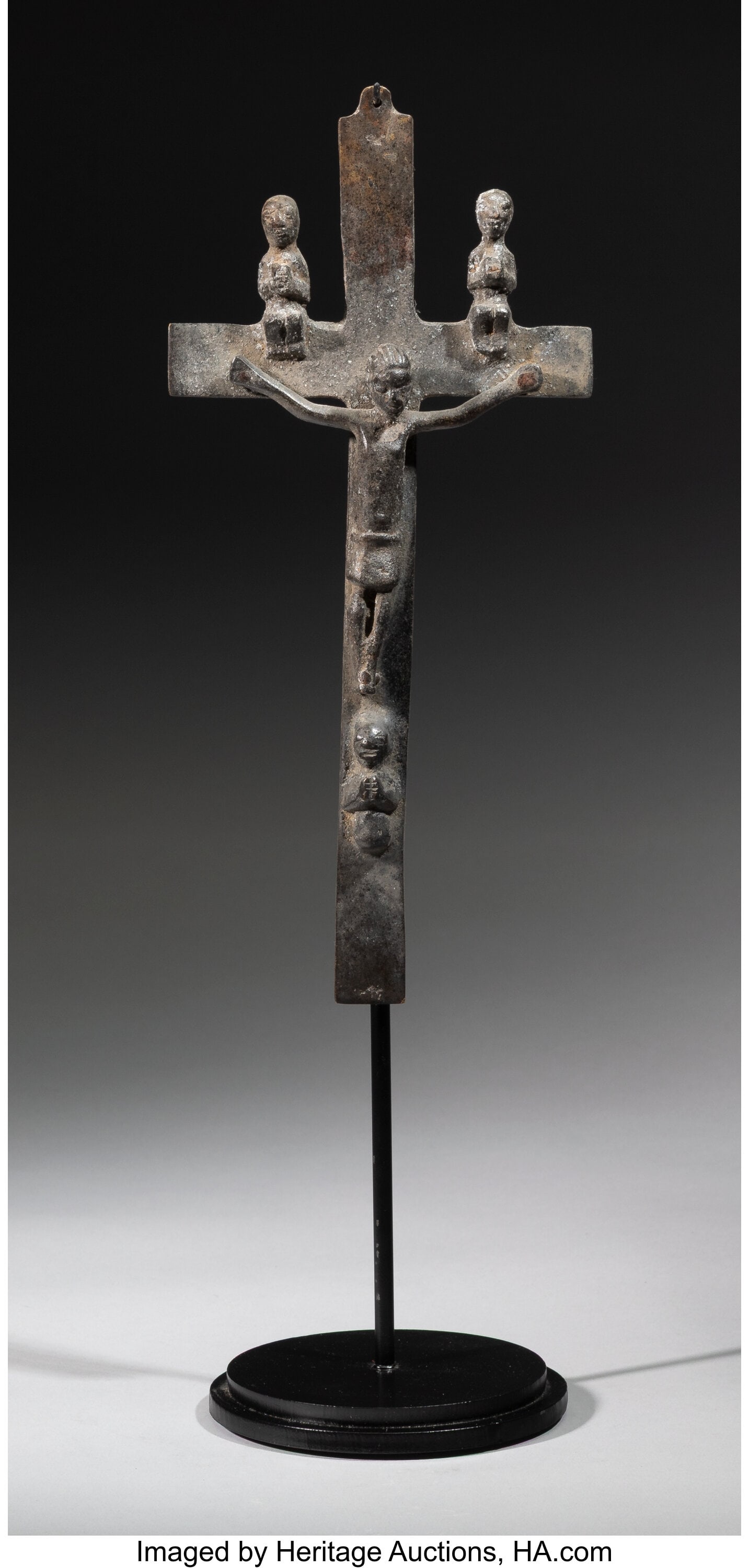 A Kongo Bronze Crucifix Democratic Republic of : A Kongo Bronze Crucifix Democratic Republic of Congo or Angola, possibly 18th century Cast in bronze with a dark patina, this crucifix presents the figure of Christ affixed to a plain cros
