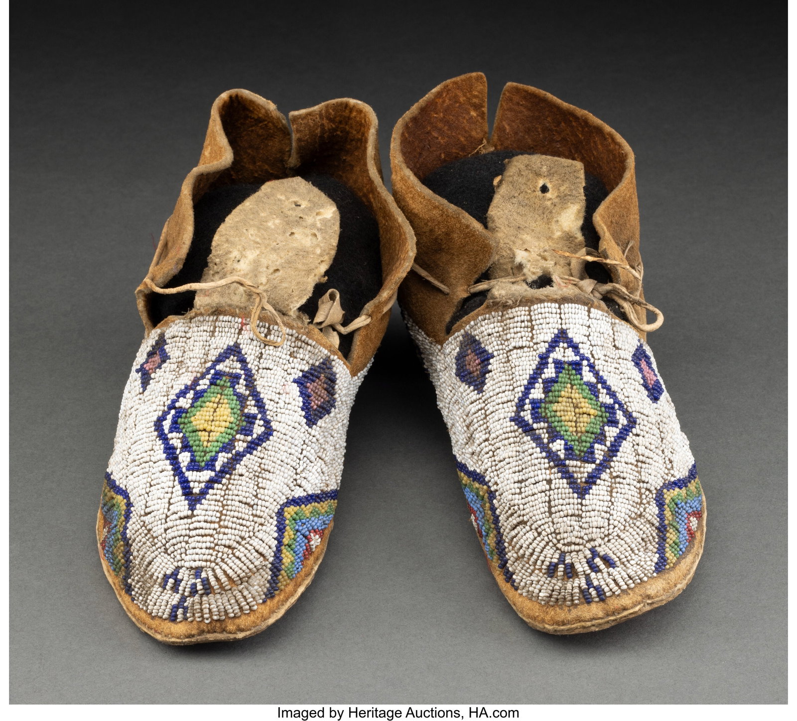 A Pair of Cheyenne Beaded Hide Moccasins c. 18 (1 of 2)