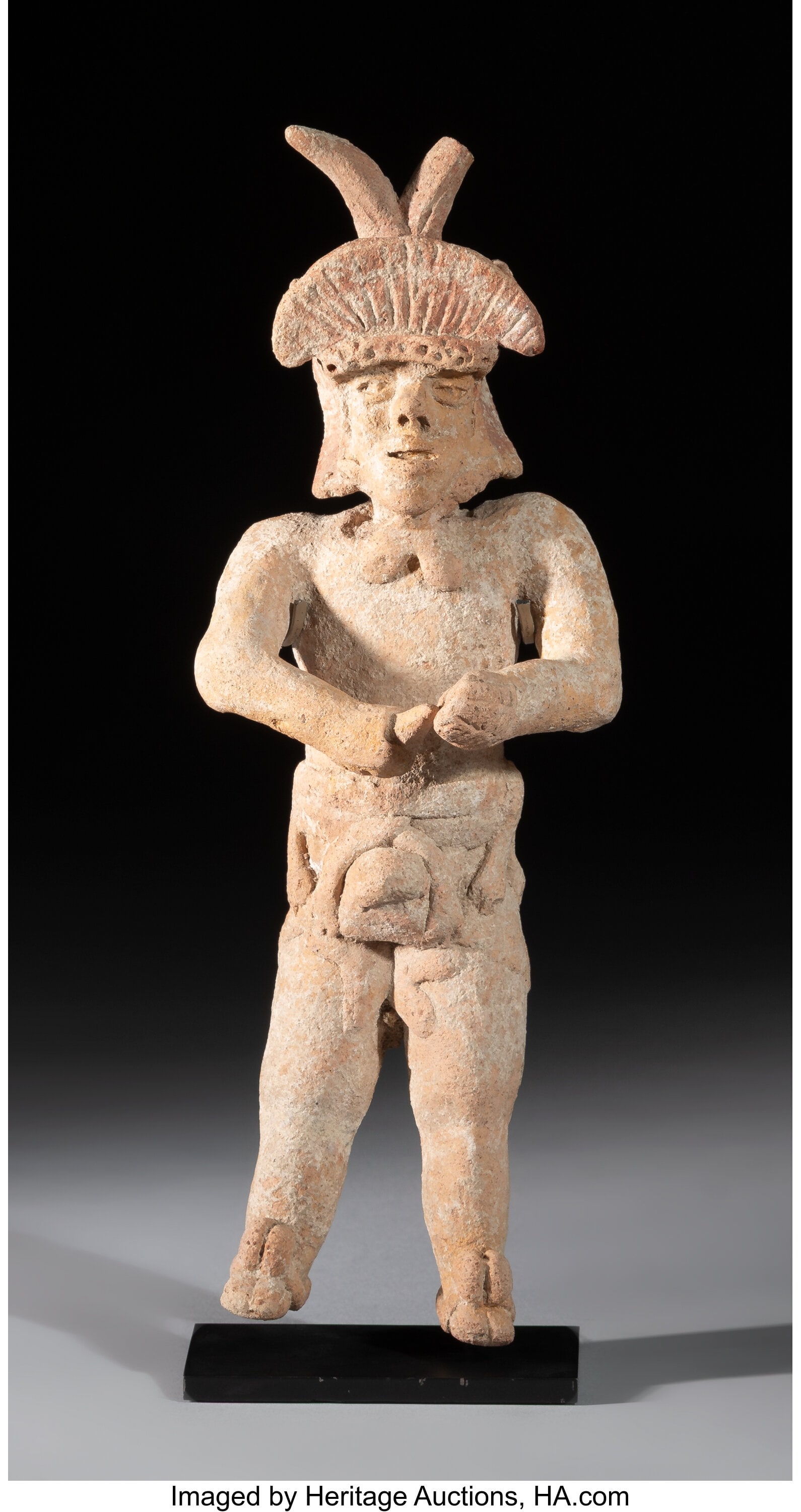 A Xochipala Standing Male Figure Guerrero, Mex: A Xochipala Standing Male Figure Guerrero, Mexico, Formative period, c. 1500 BCE–200 CE Solid ceramic. The figure stands frontally, wearing an elaborate