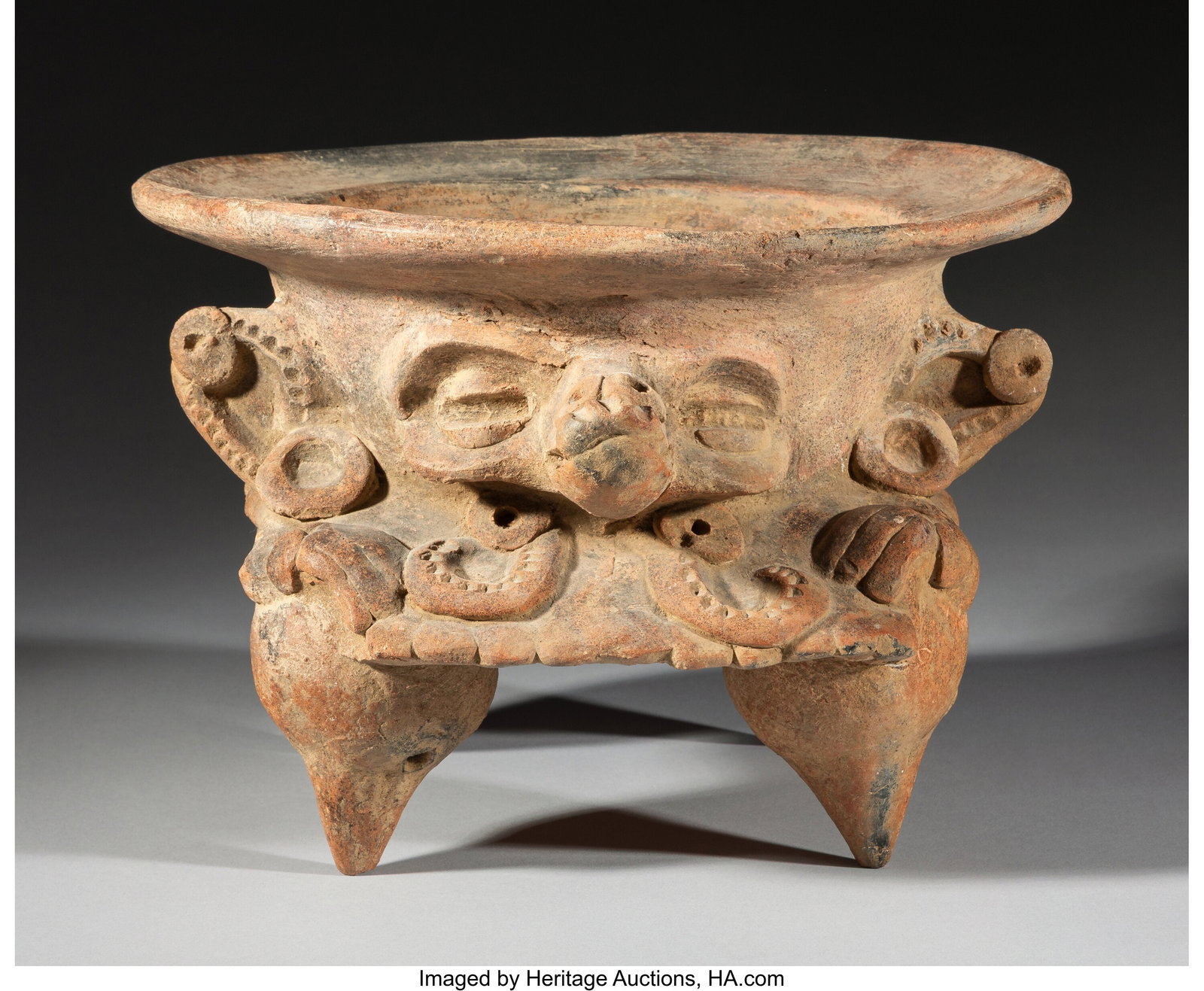A Maya Tetrapod Incensario Mesoamerica, c. 800: A Maya Tetrapod Incensario Mesoamerica, c. 800–1000 AD Buff-colored ceramic with blackened firing clouds from reduction firing. Raised on four mammiform supports, this