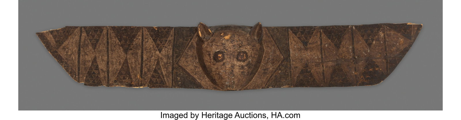 A Large Bwa Horizontal Bat Mask Burkina Faso, : A Large Bwa Horizontal Bat Mask Burkina Faso, c. 20th century This striking horizontal plank mask is centered by the projecting head of a bat, from which long wings extend outward t