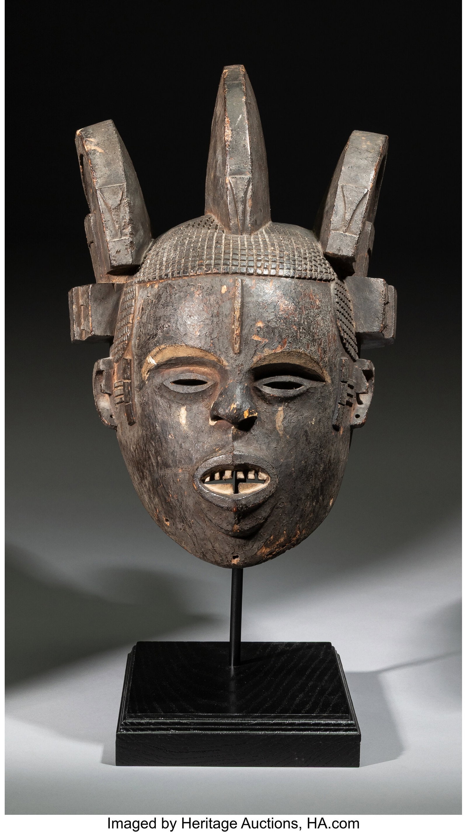 An Igbo or Ibibio Helmet Mask Nigeria, 20th ce (1 of 4)