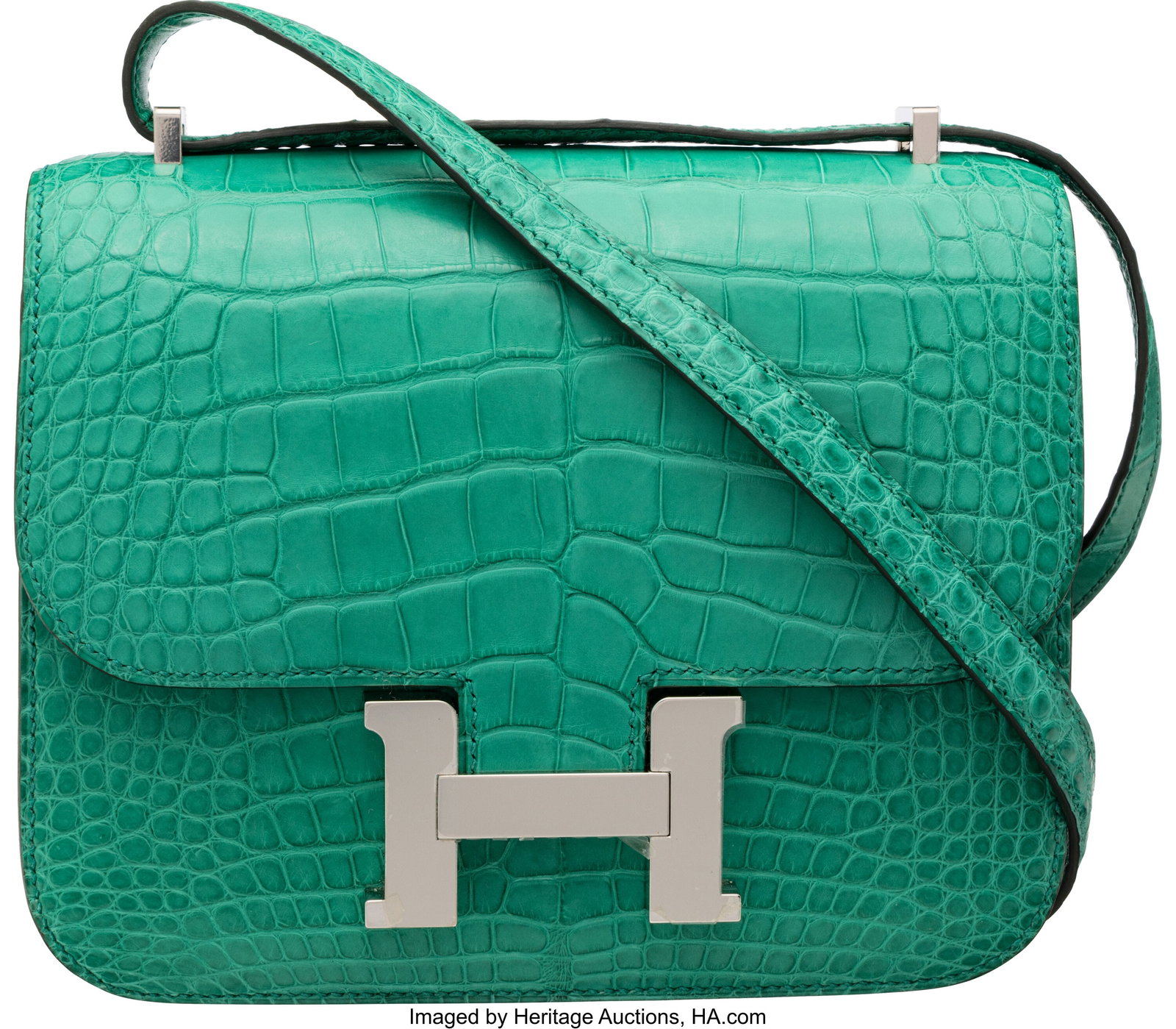 Hermès 18cm Matte Vert Jade Alligator Mini Cons: Hermès 18cm Matte Vert Jade Alligator Mini Constance Bag with Palladium Hardware U, 2022 Condition: 2 7.25" Width x 5.5" Height x 2" Depth This bag is done in Matte Ve