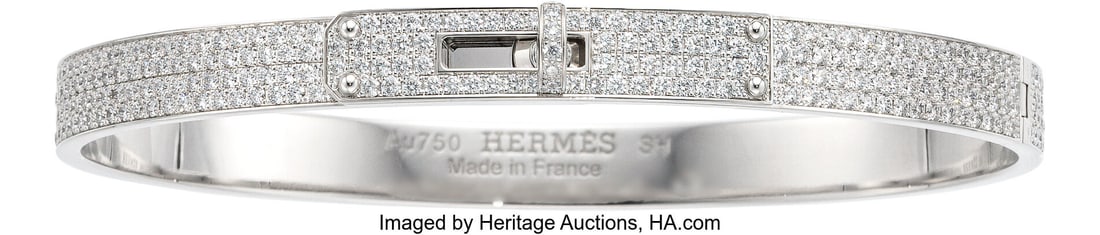 Hermès 18K White Gold Full Pave Diamond Kelly B: Hermès 18K White Gold Full Pave Diamond Kelly Bracelet, Small Model Condition: 1 Designer Size SH This bracelet is done in 18K White Gold, featuring pave-set diamonds and a Ke