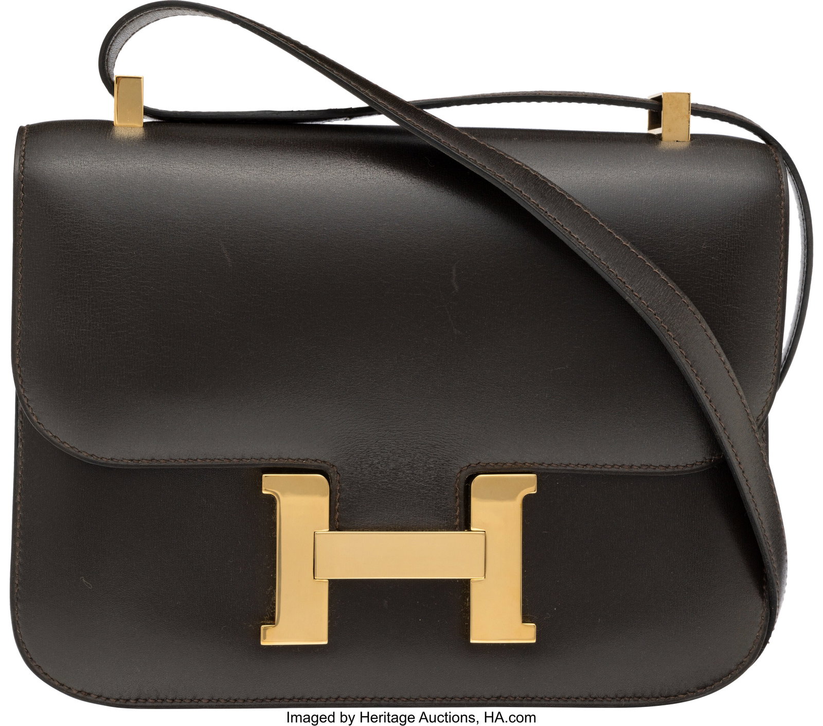 Hermès Vintage 24cm Marron Fonce Box Calf Leath: Hermès Vintage 24cm Marron Fonce Box Calf Leather Constance Bag with Gold Hardware U Circle, 1991 Condition: 2 9" Width x 7" Height x 1.75" Depth This bag is done in Marron F