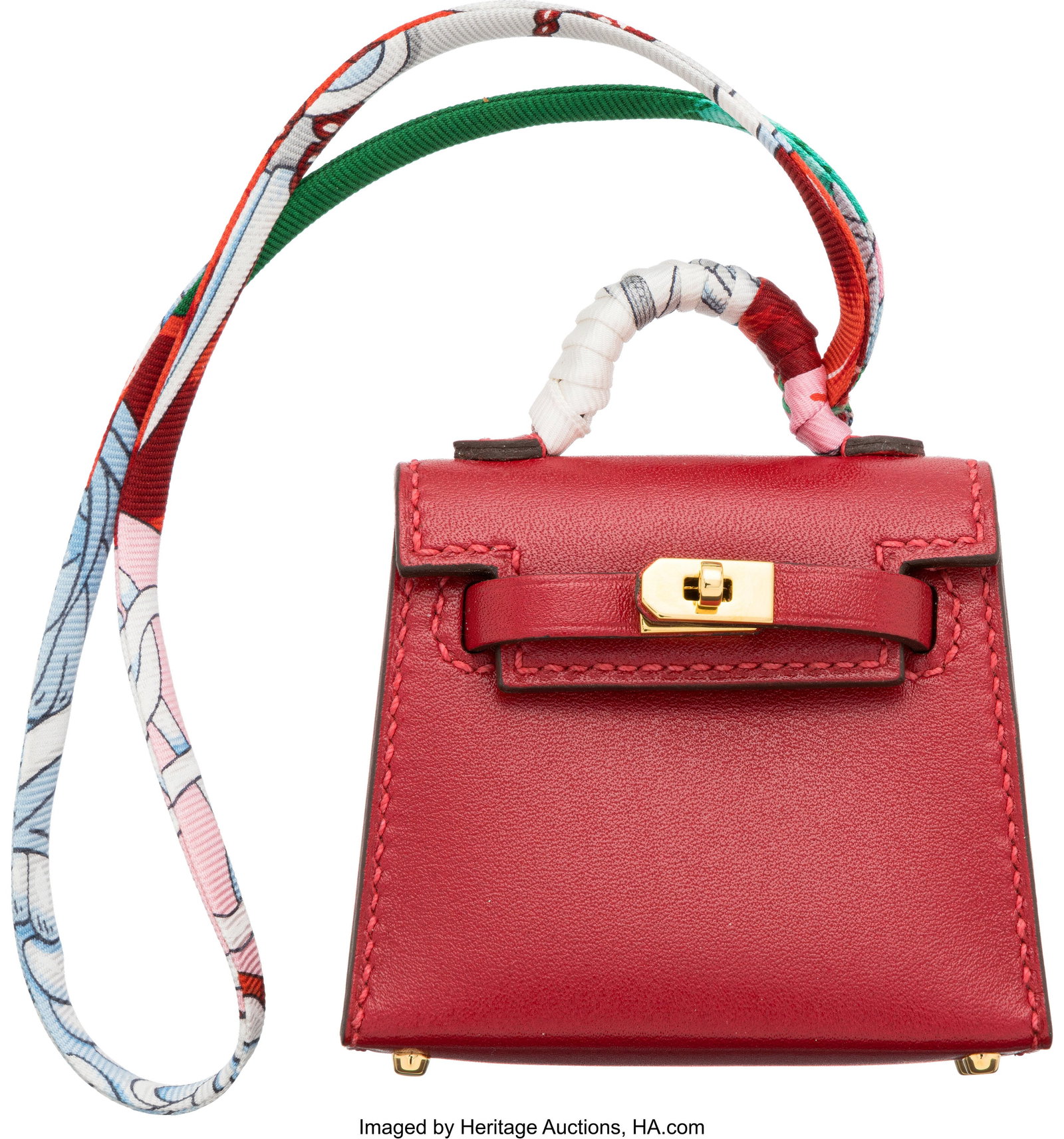 Hermès Rouge Vif Tadelakt Leather Micro Mini Tw: Hermès Rouge Vif Tadelakt Leather Micro Mini Twilly Bag Charm with Gold Hardware Y, 2020 Condition: 1 2.5" Width x 2.25" Height x 1" Depth This bag charm is done in Ro